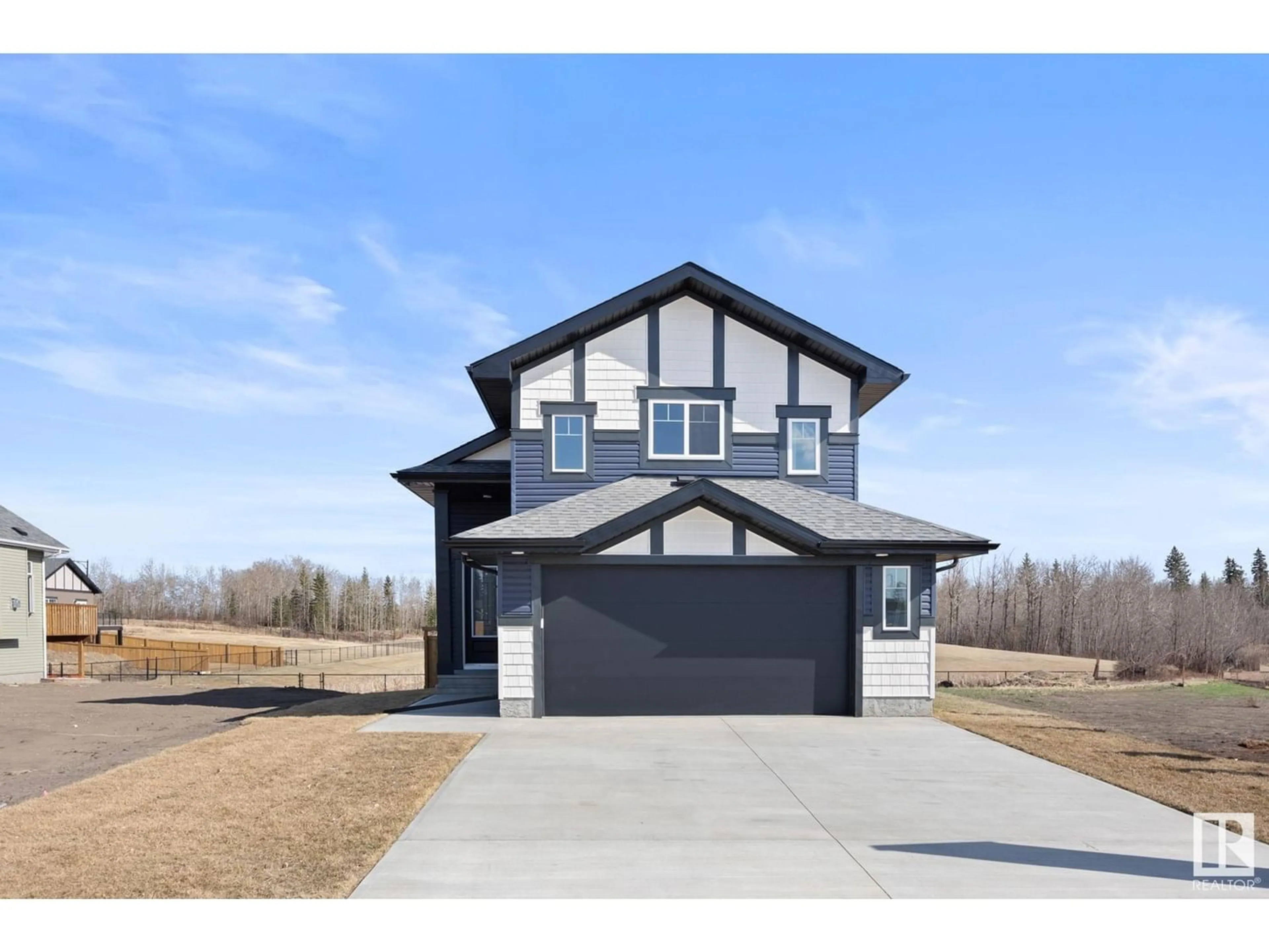 Frontside or backside of a home for 63 MAPLE CR, Gibbons Alberta T0A1N0
