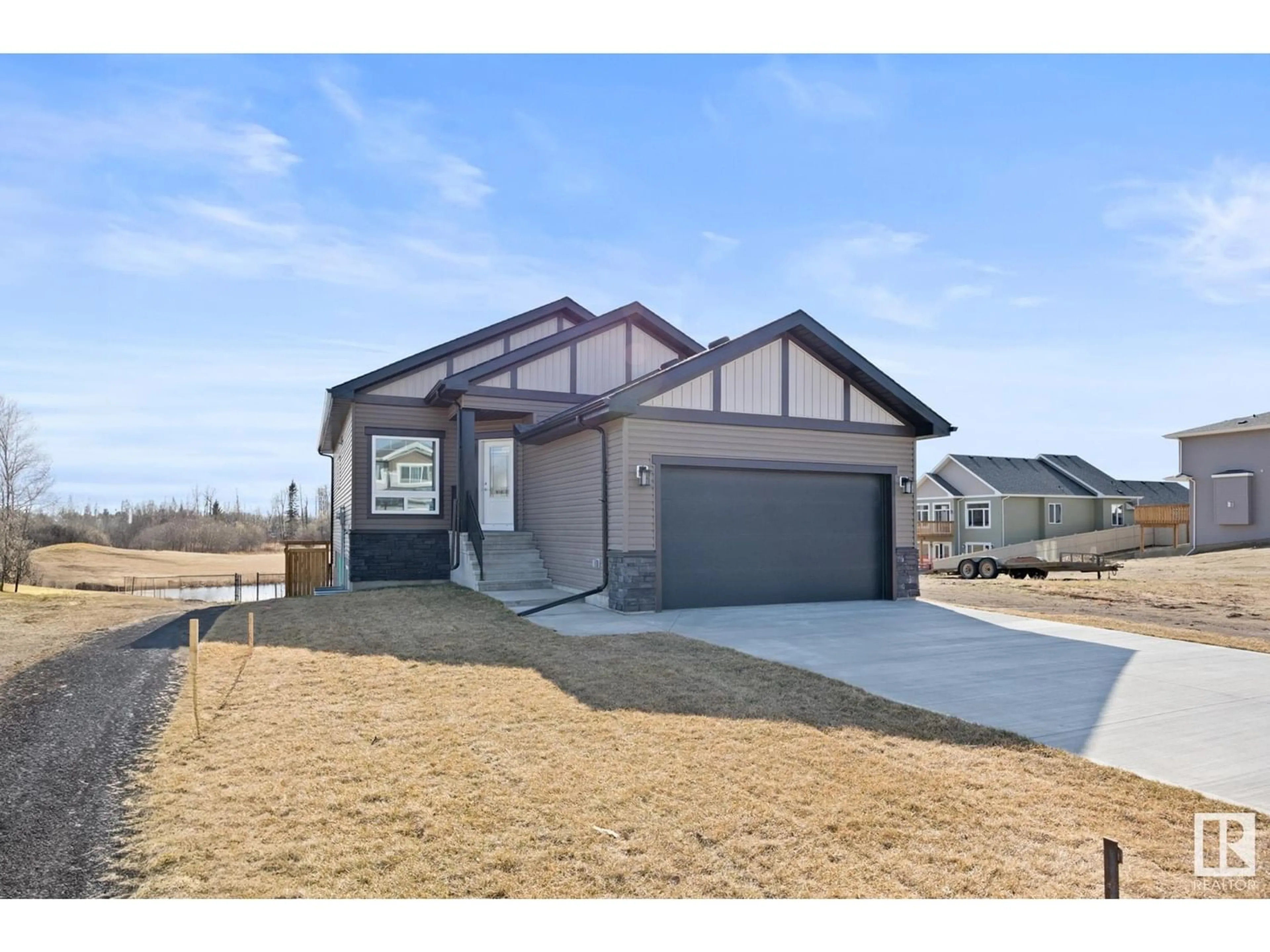 Frontside or backside of a home for 31 MAPLE CR, Gibbons Alberta T0A1N0