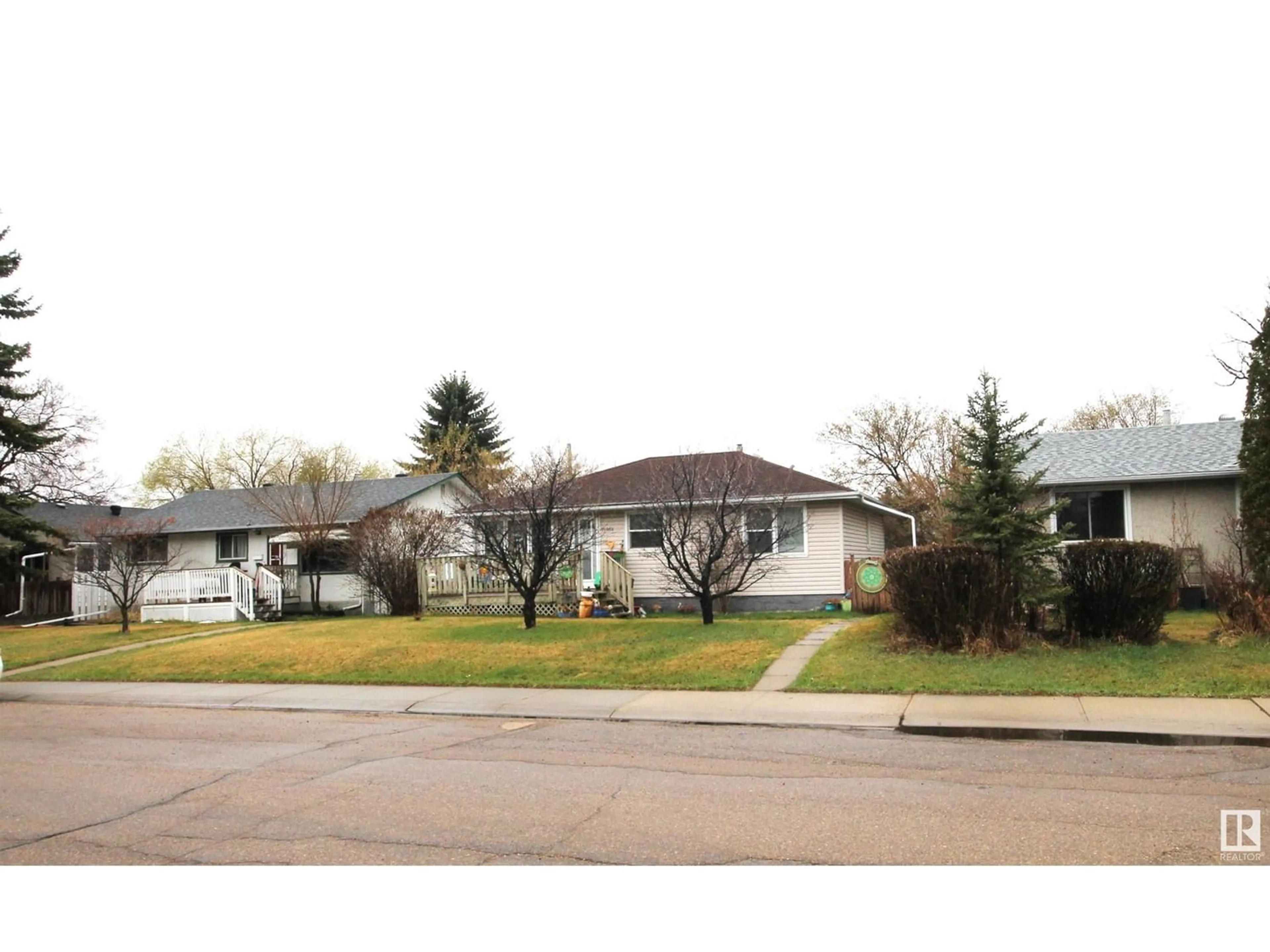 Frontside or backside of a home for 15956 105 AV NW, Edmonton Alberta T5P0T9