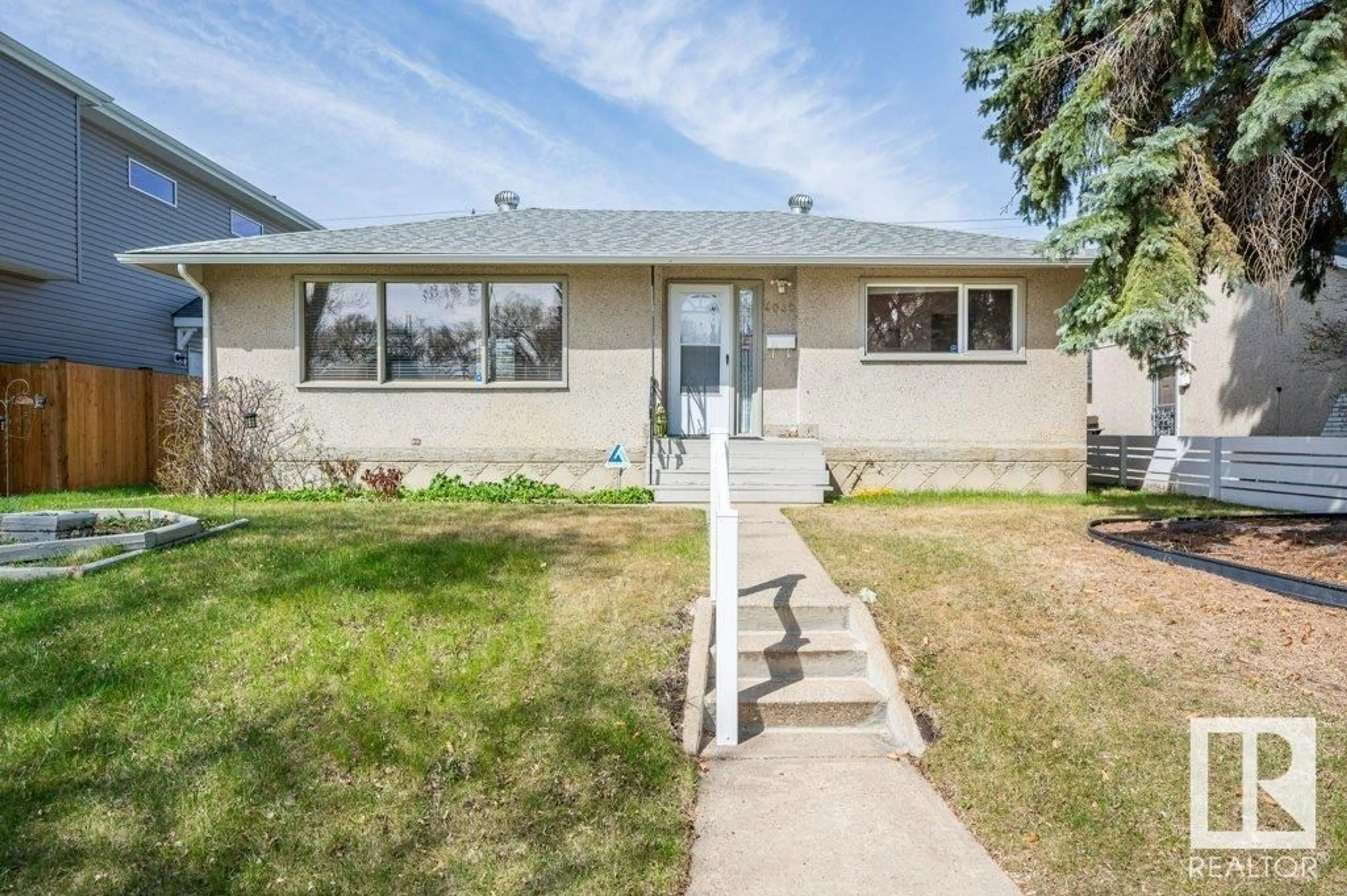 Frontside or backside of a home for 4030 113 AV NW, Edmonton Alberta T5W0R3