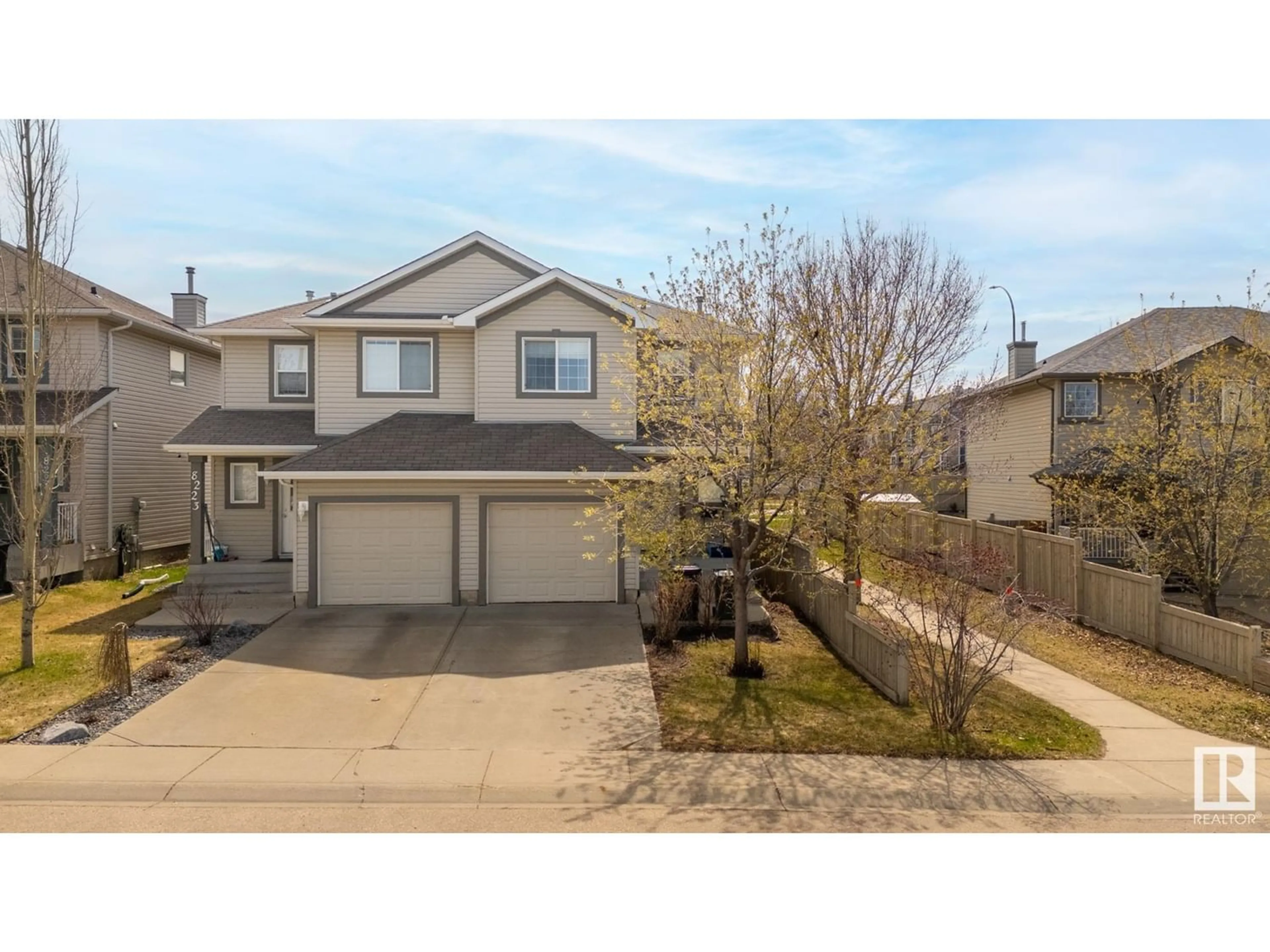 Frontside or backside of a home for 8225 8 AV SW, Edmonton Alberta T6X1L7