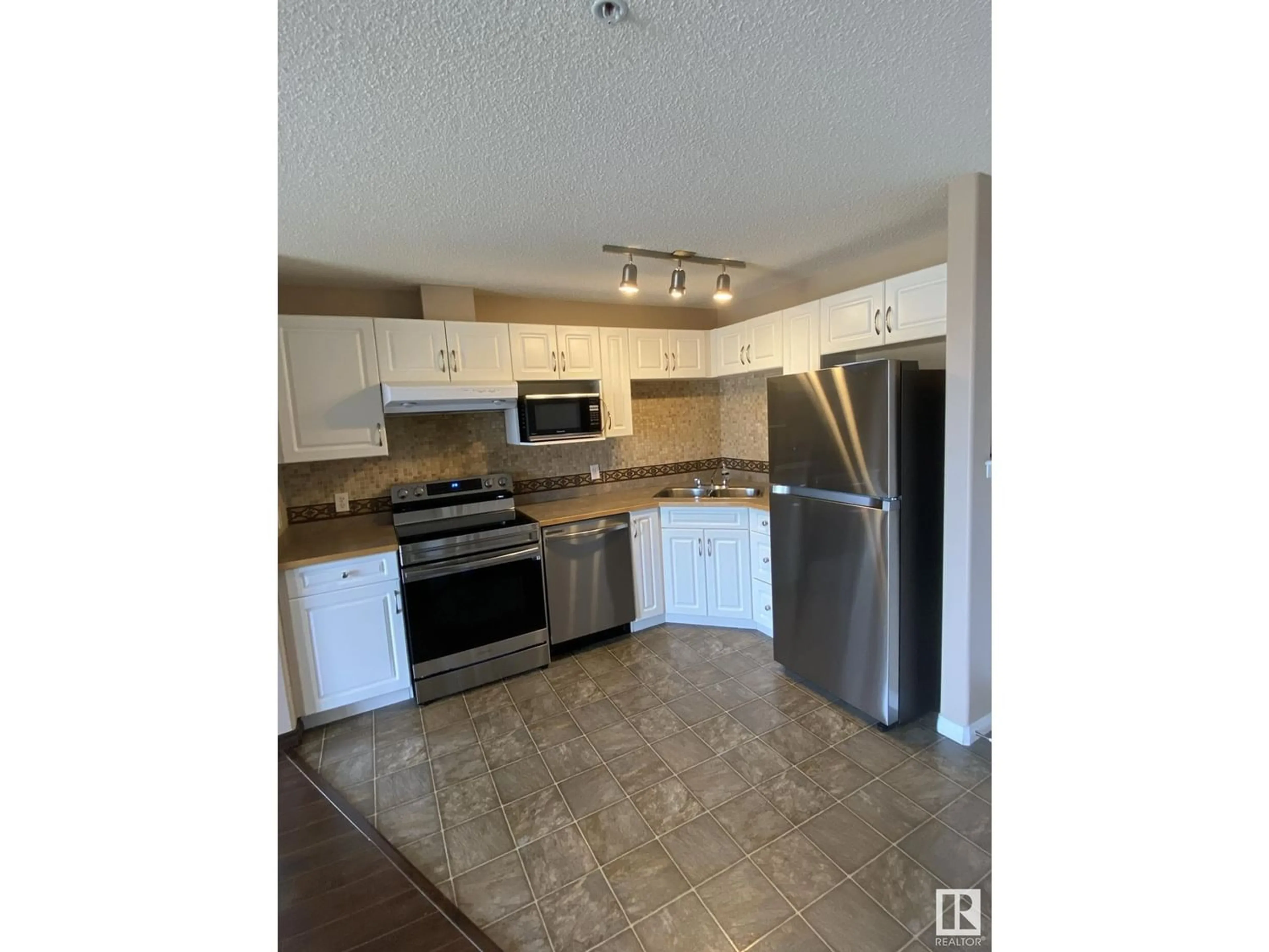 Kitchen for #323 3425 19 ST NW, Edmonton Alberta T6T2B5