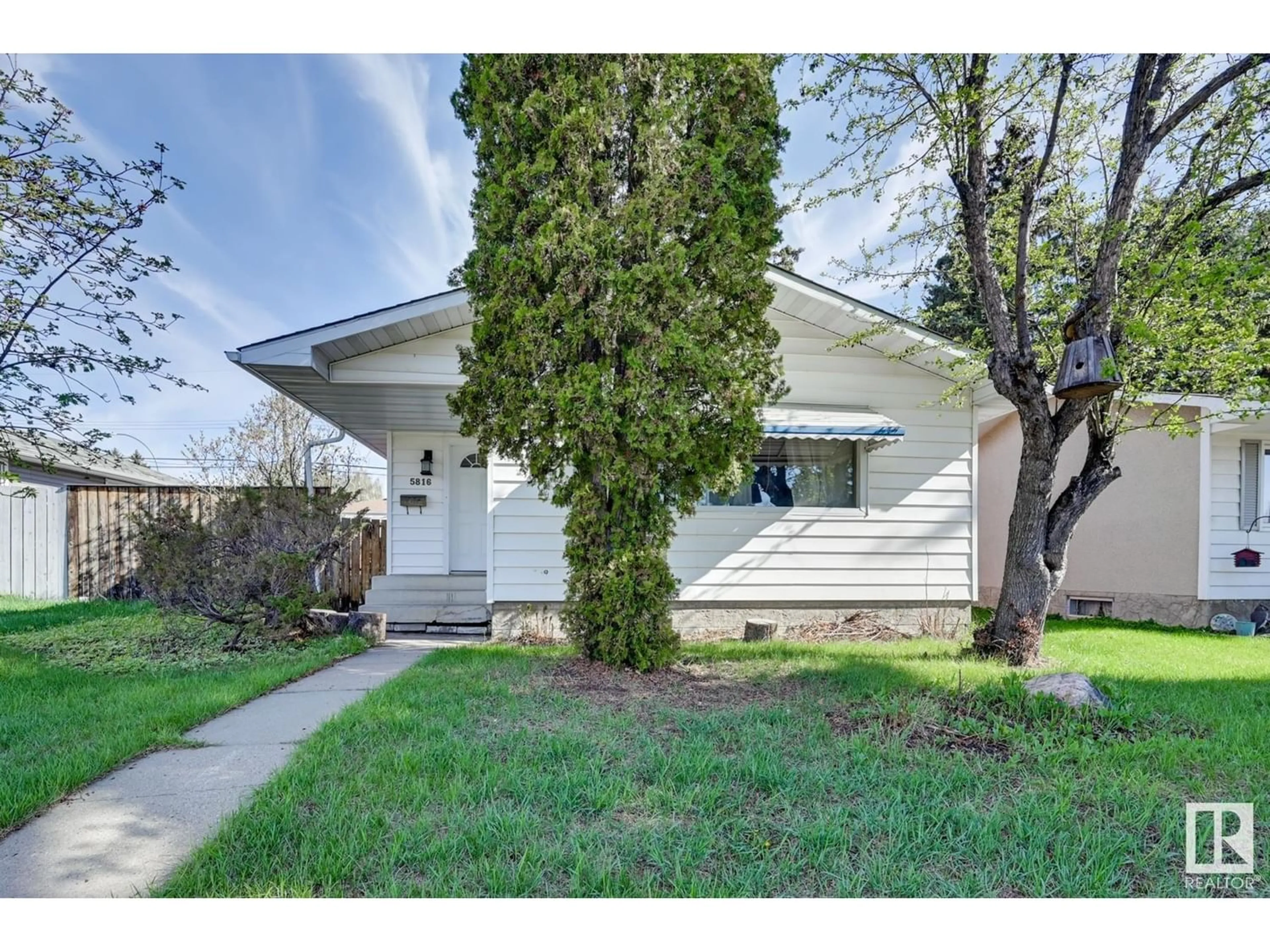 Frontside or backside of a home for 5816 140 AV NW, Edmonton Alberta T5A1G5