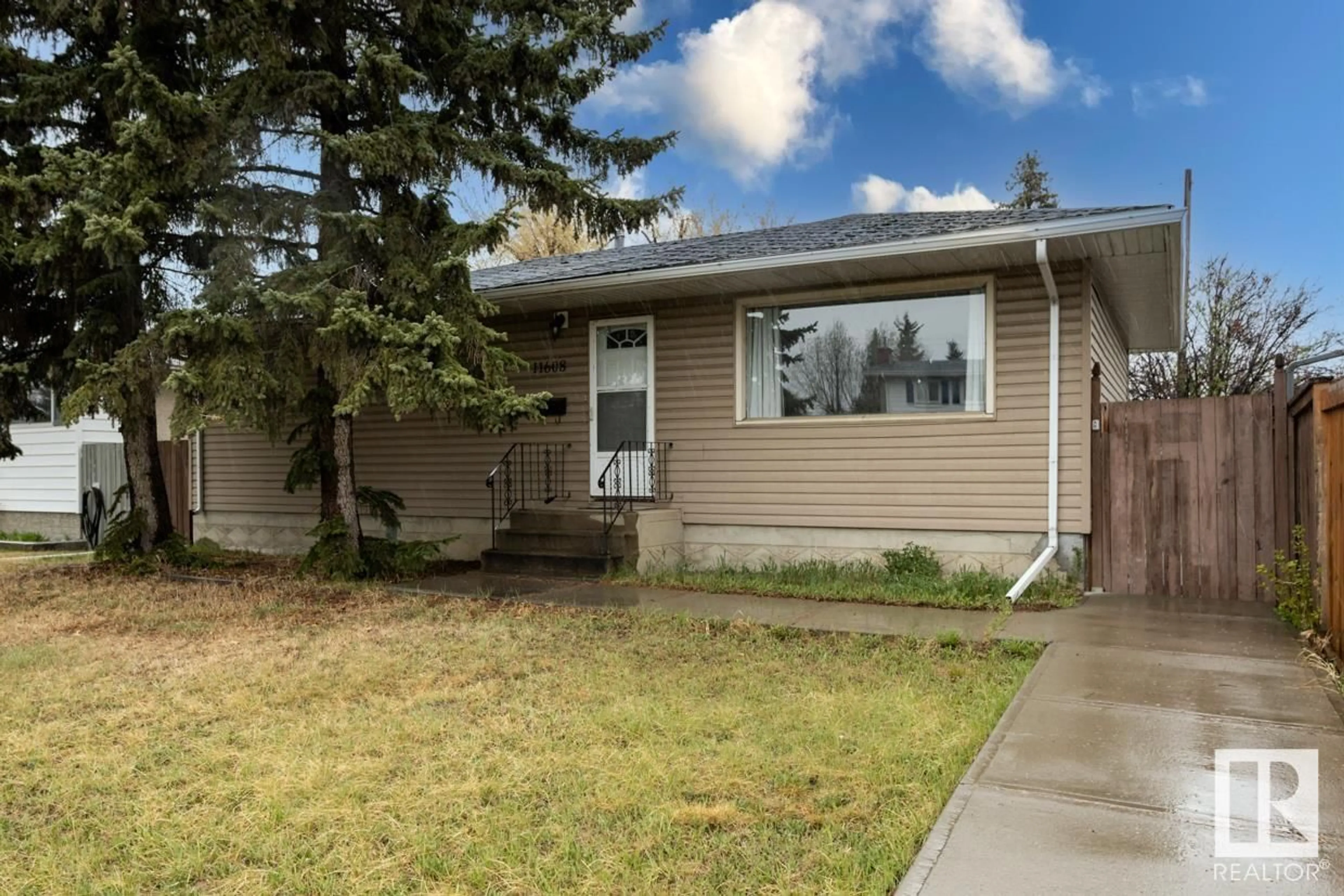 Home with vinyl exterior material for 11608 134 AV NW, Edmonton Alberta T5K4M4