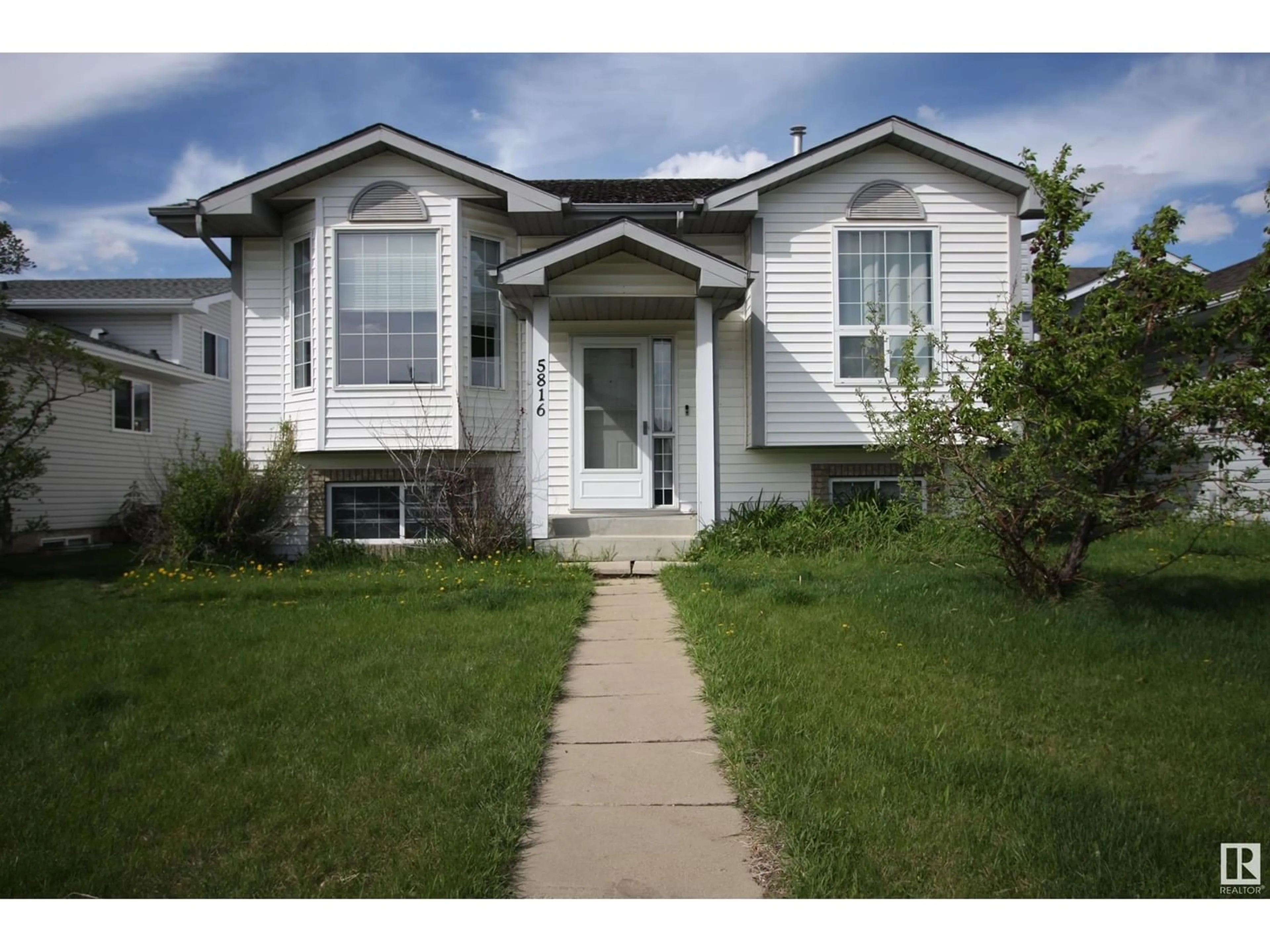 Frontside or backside of a home for 5816 162 AV NW, Edmonton Alberta T5Y2S8