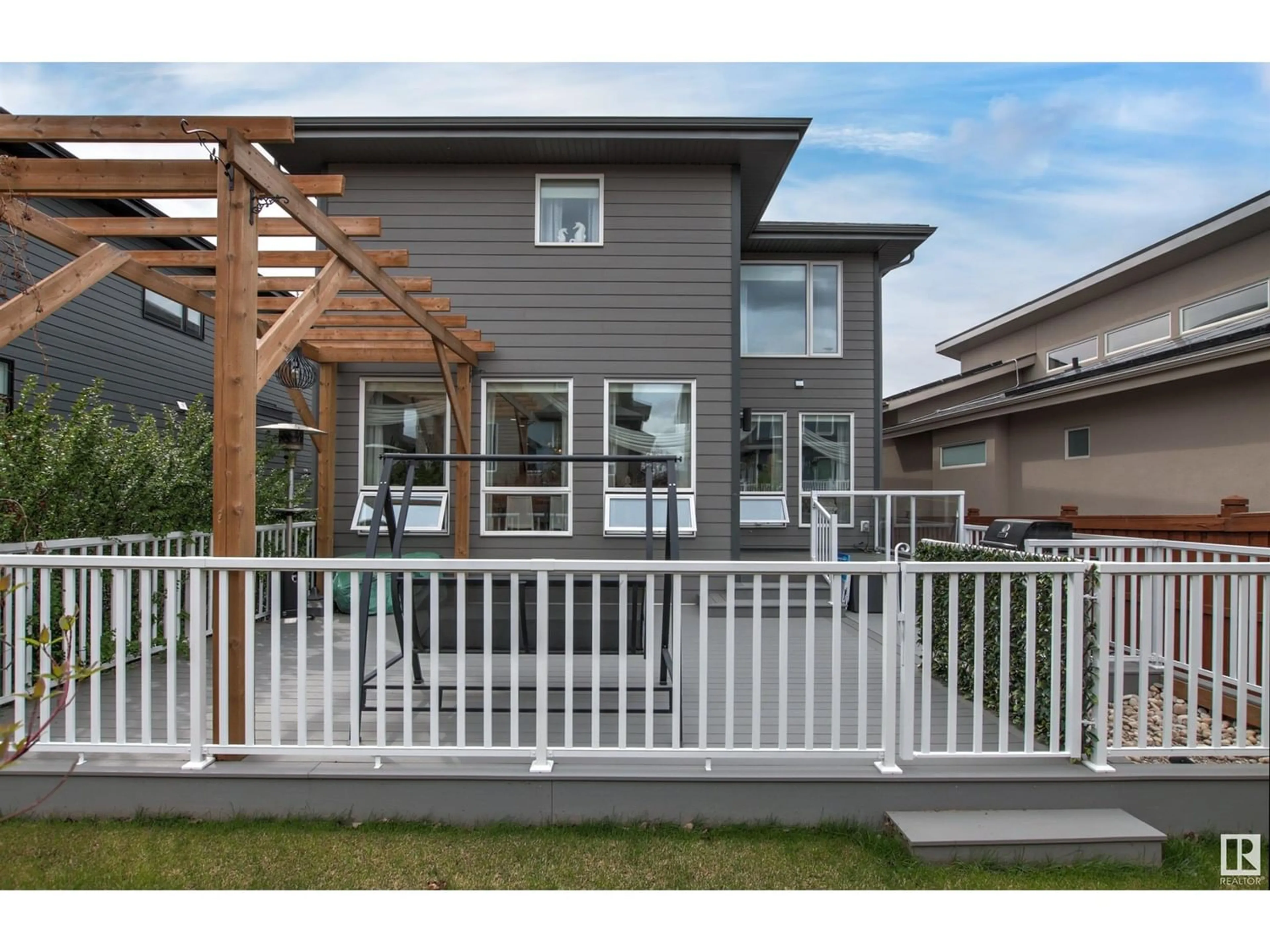 Frontside or backside of a home, the fenced backyard for 1311 HAINSTOCK WY SW SW, Edmonton Alberta T6W3B6