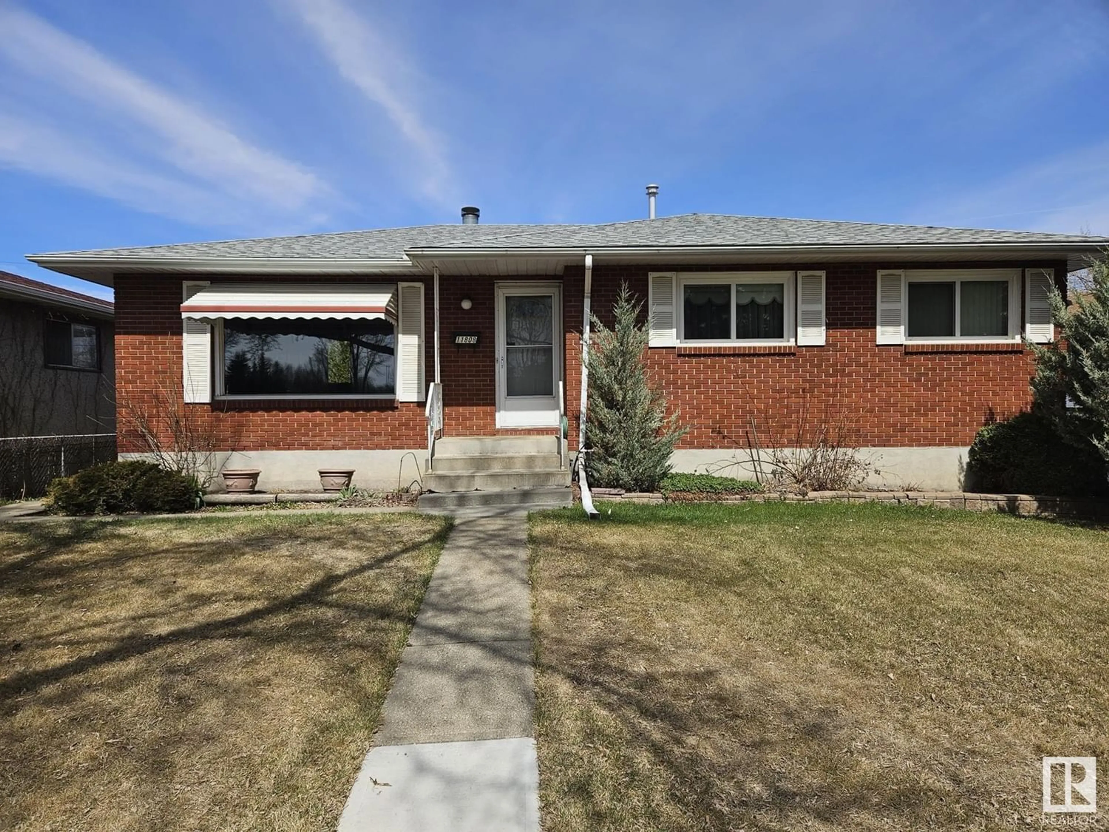 Frontside or backside of a home for 11808 131 AV NW, Edmonton Alberta T5E0W8