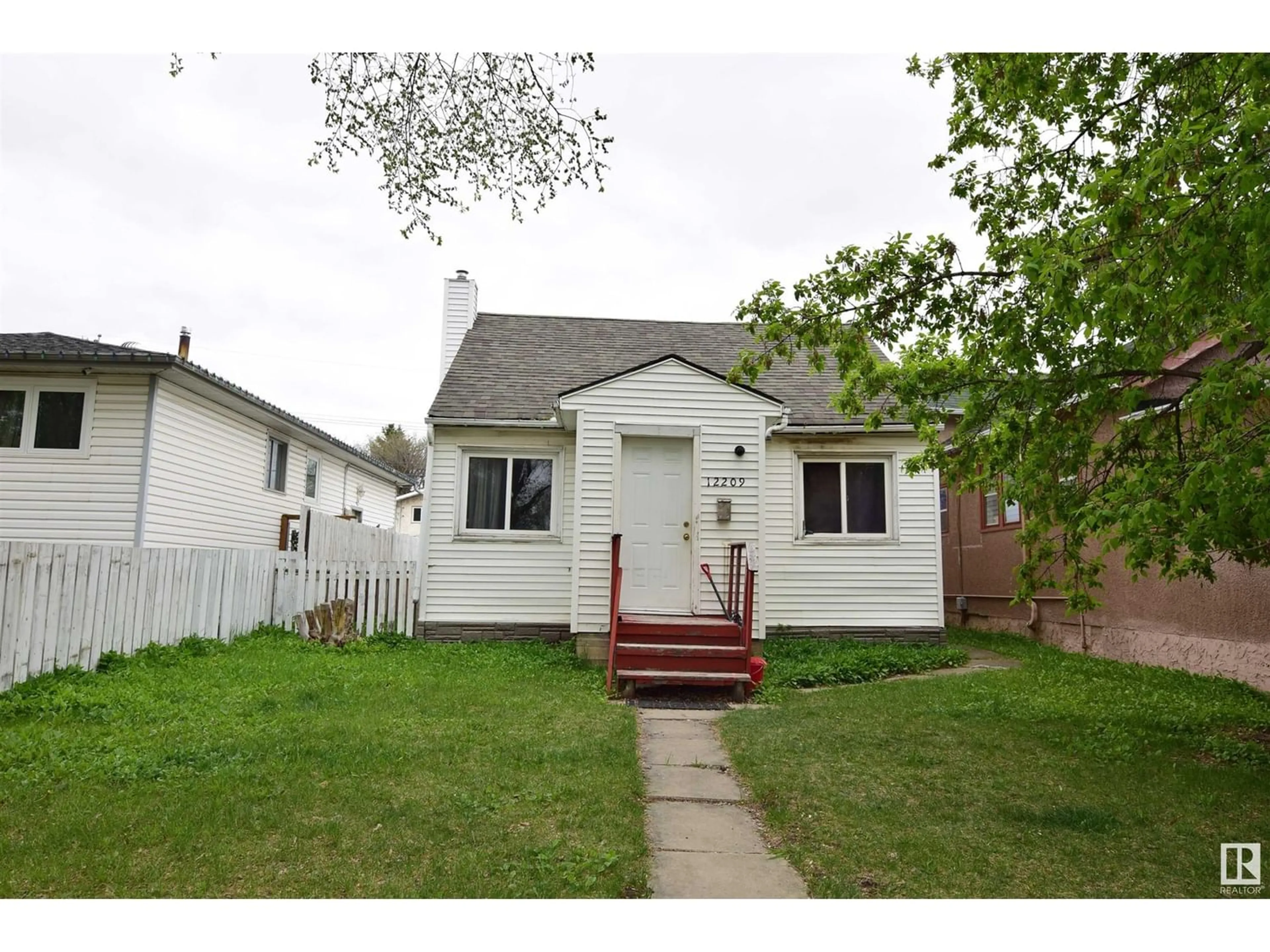 Frontside or backside of a home for 12209 92 ST NW, Edmonton Alberta T5G1B4