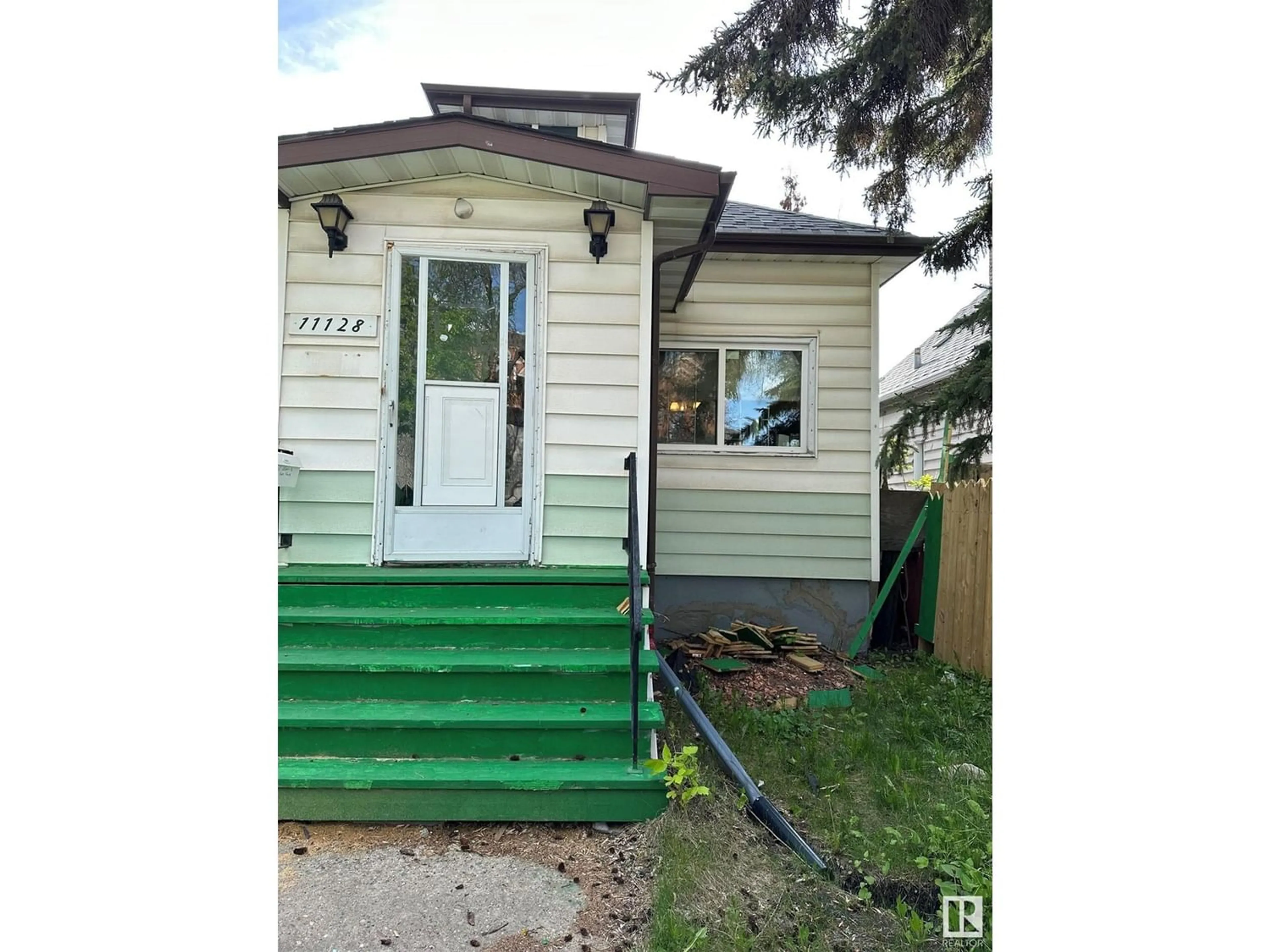 Frontside or backside of a home for 11128 95A ST NW, Edmonton Alberta T5G1N7