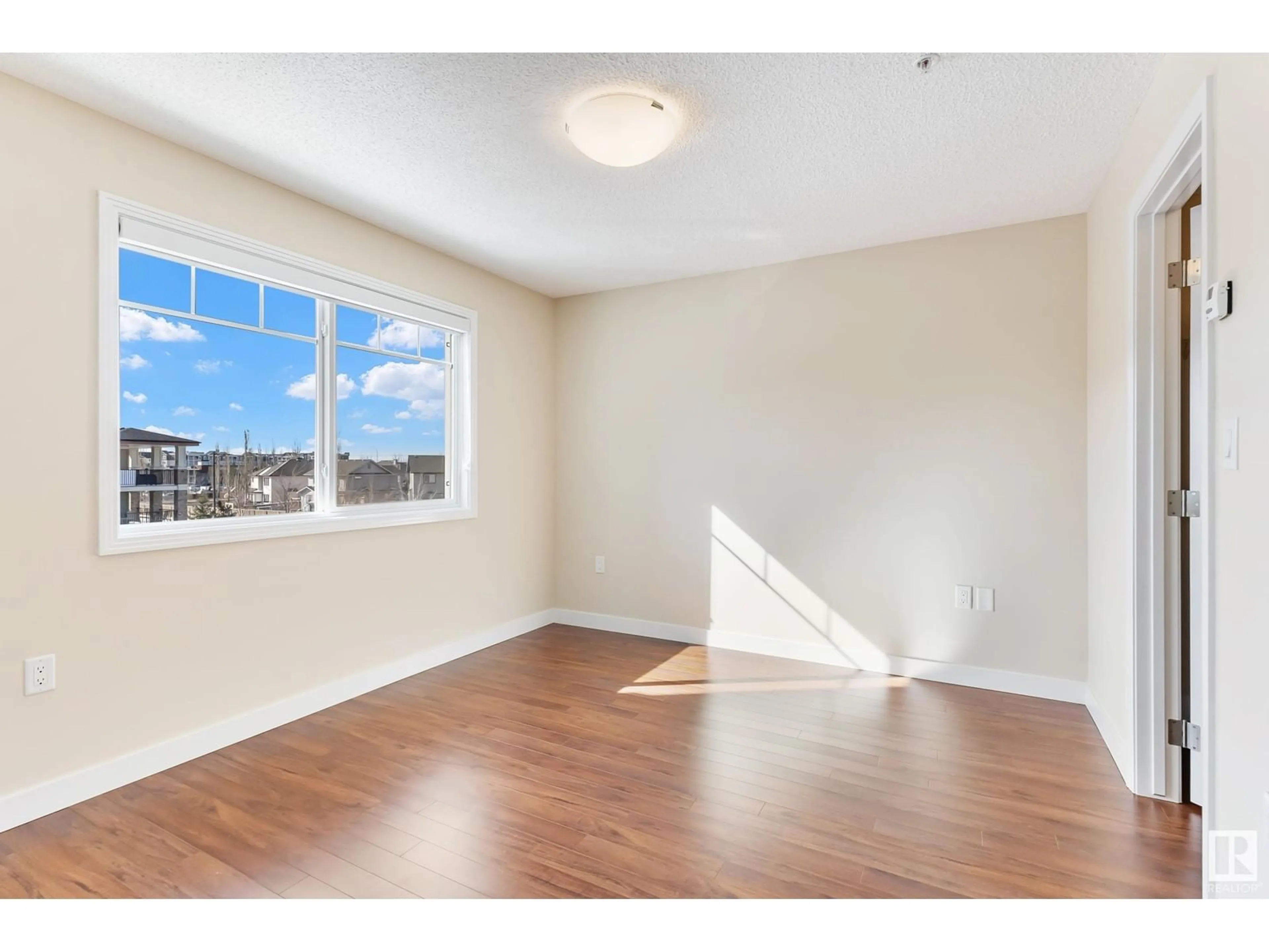 A pic of a room, wood floors for #404 7021 South Terwillegar DR NW, Edmonton Alberta T6R3V7