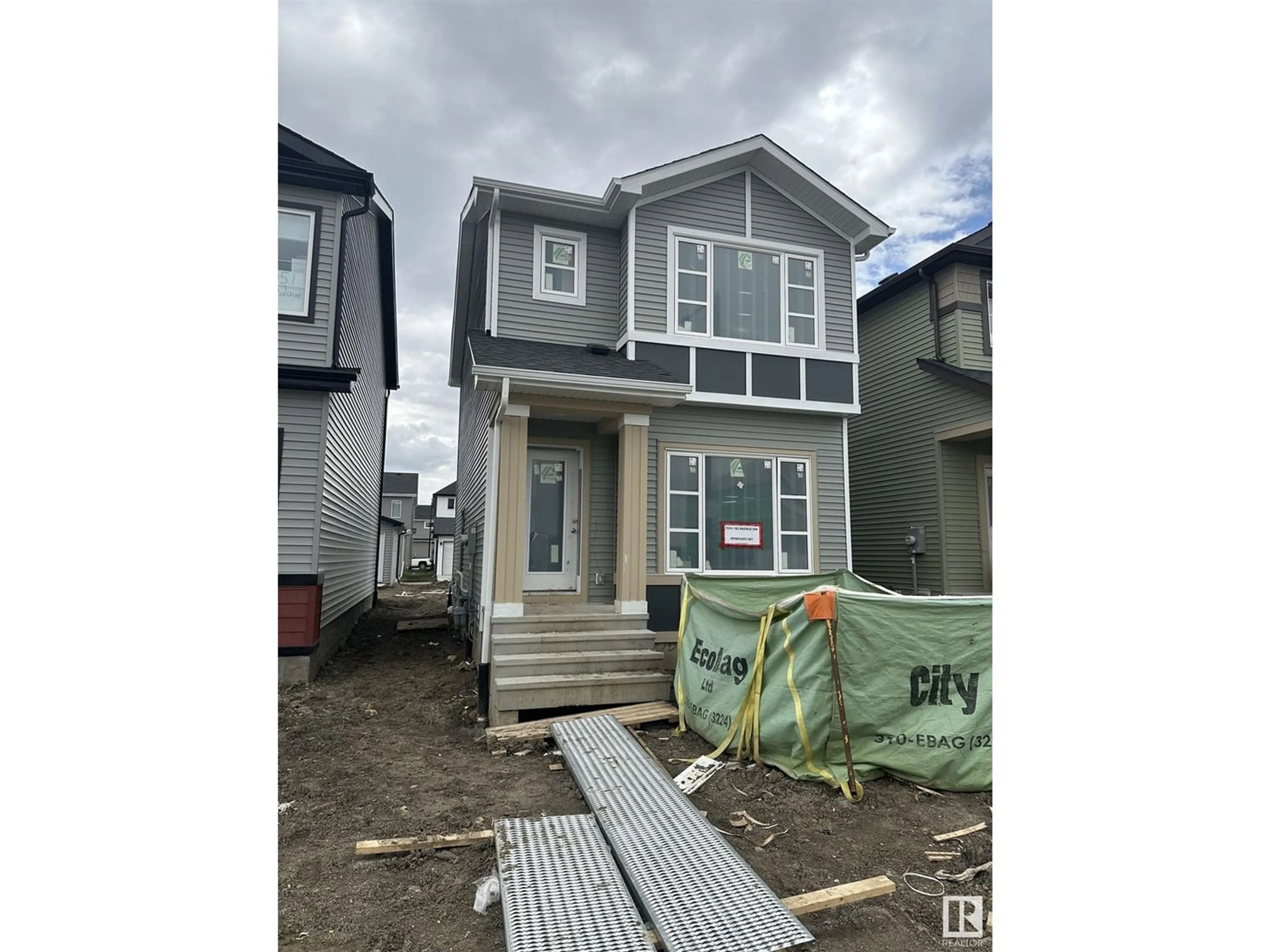 Frontside or backside of a home for 7055 182 AV NW, Edmonton Alberta T5Z0V7