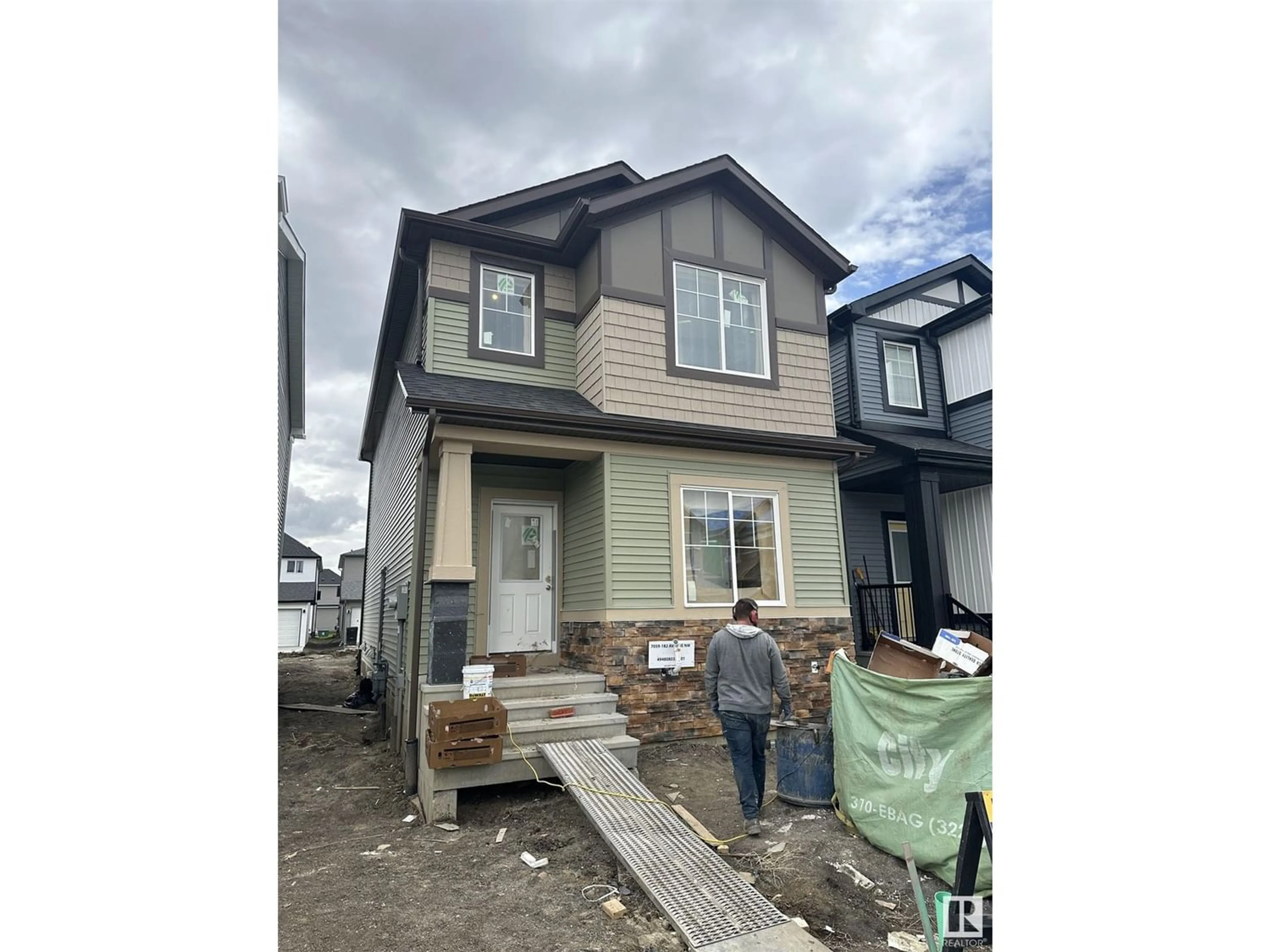 Frontside or backside of a home for 7059 182 AV NW, Edmonton Alberta T5Z0V7