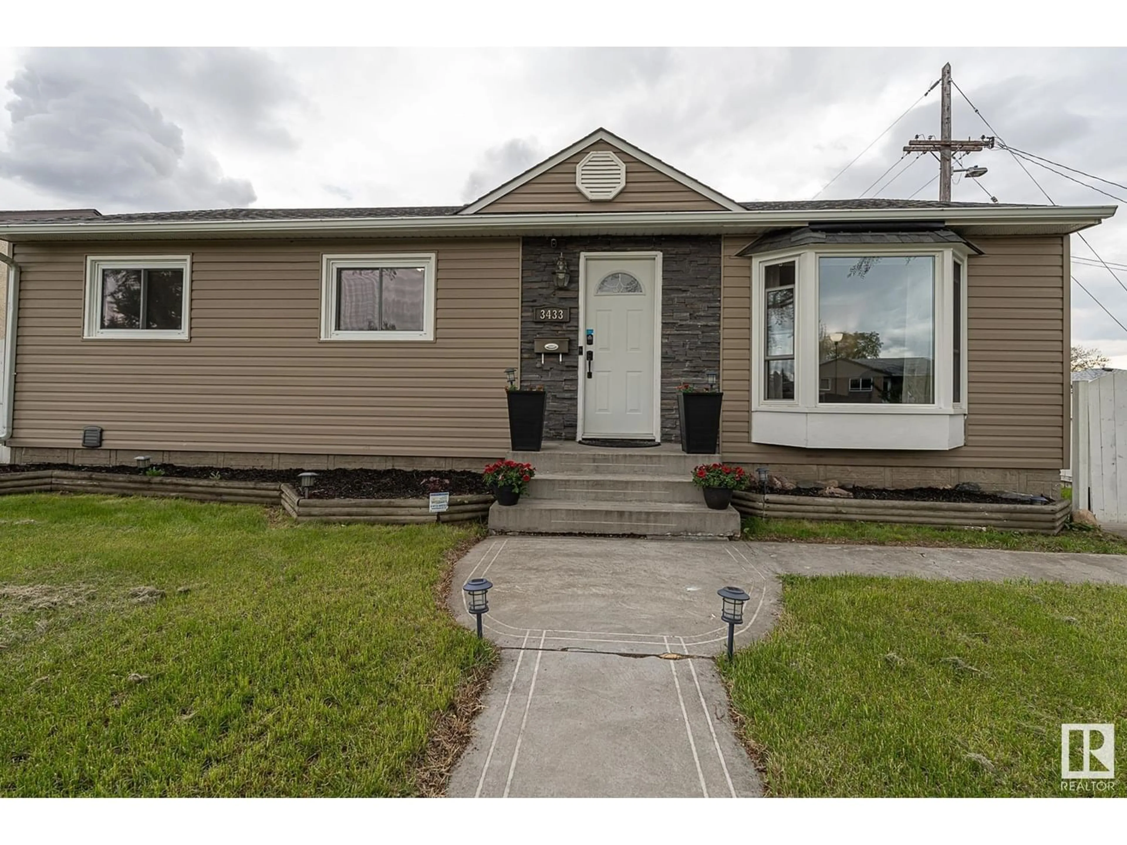 Frontside or backside of a home for 3433 120 AV NW, Edmonton Alberta T5W1K1