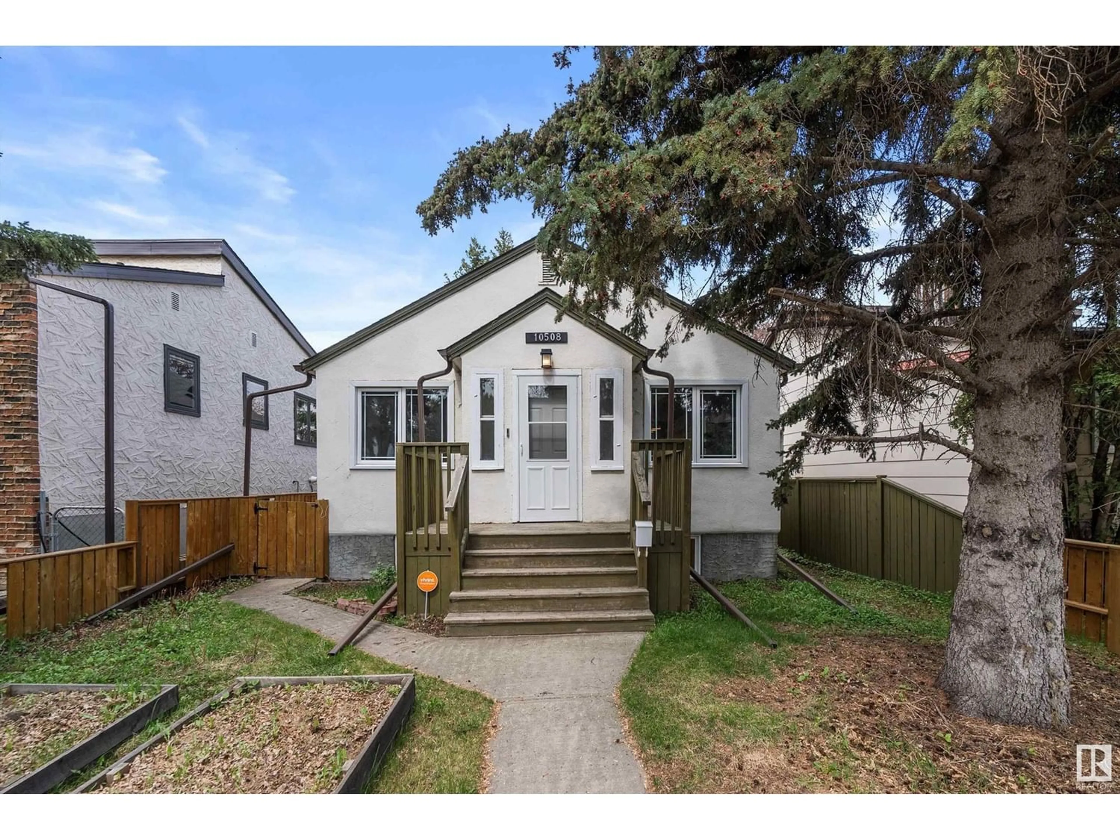 Frontside or backside of a home for 10508 70 AV NW, Edmonton Alberta T6H2E9