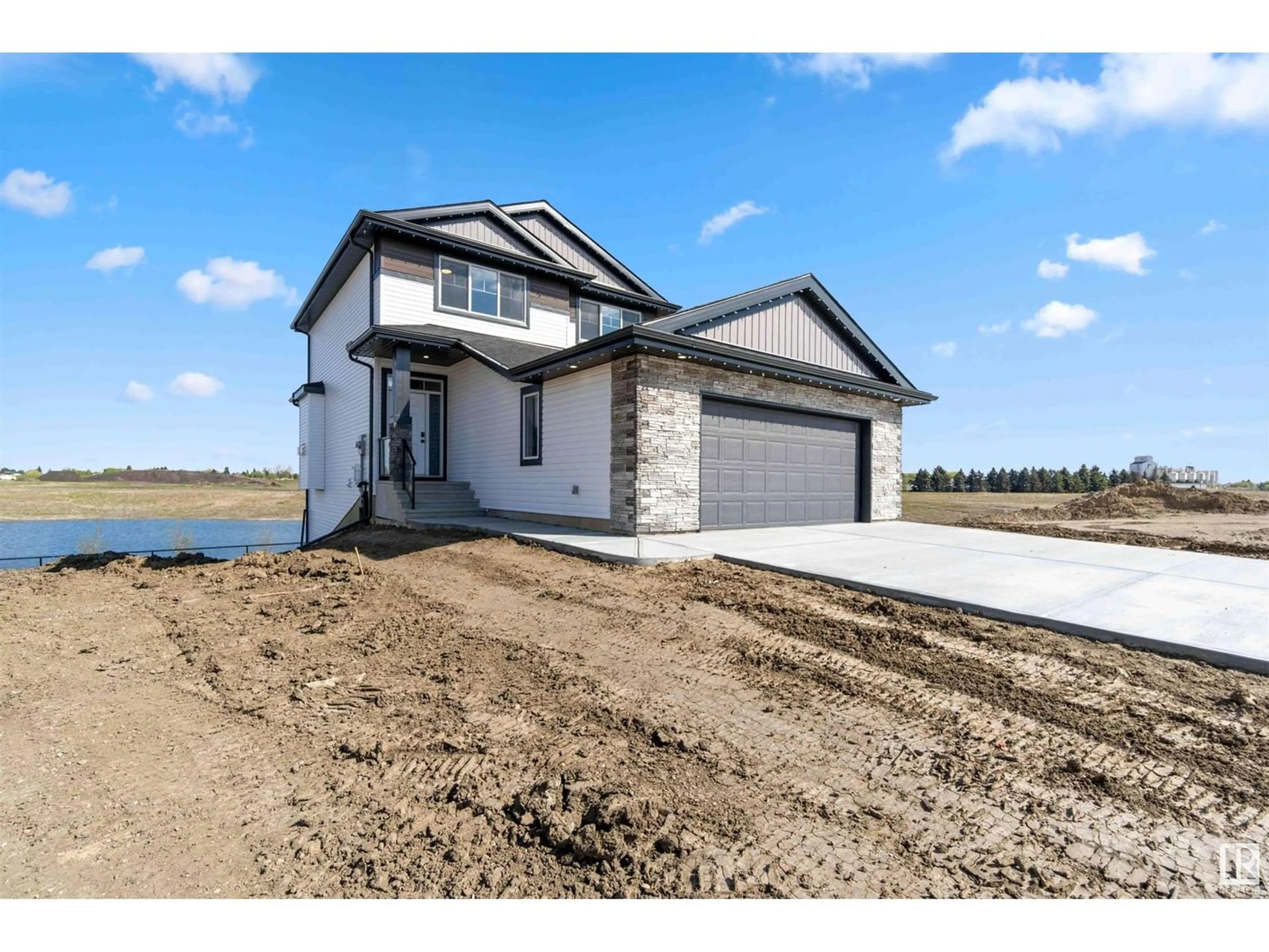 Frontside or backside of a home, the fenced backyard for 72 Maple CR, Gibbons Alberta T0A1N0