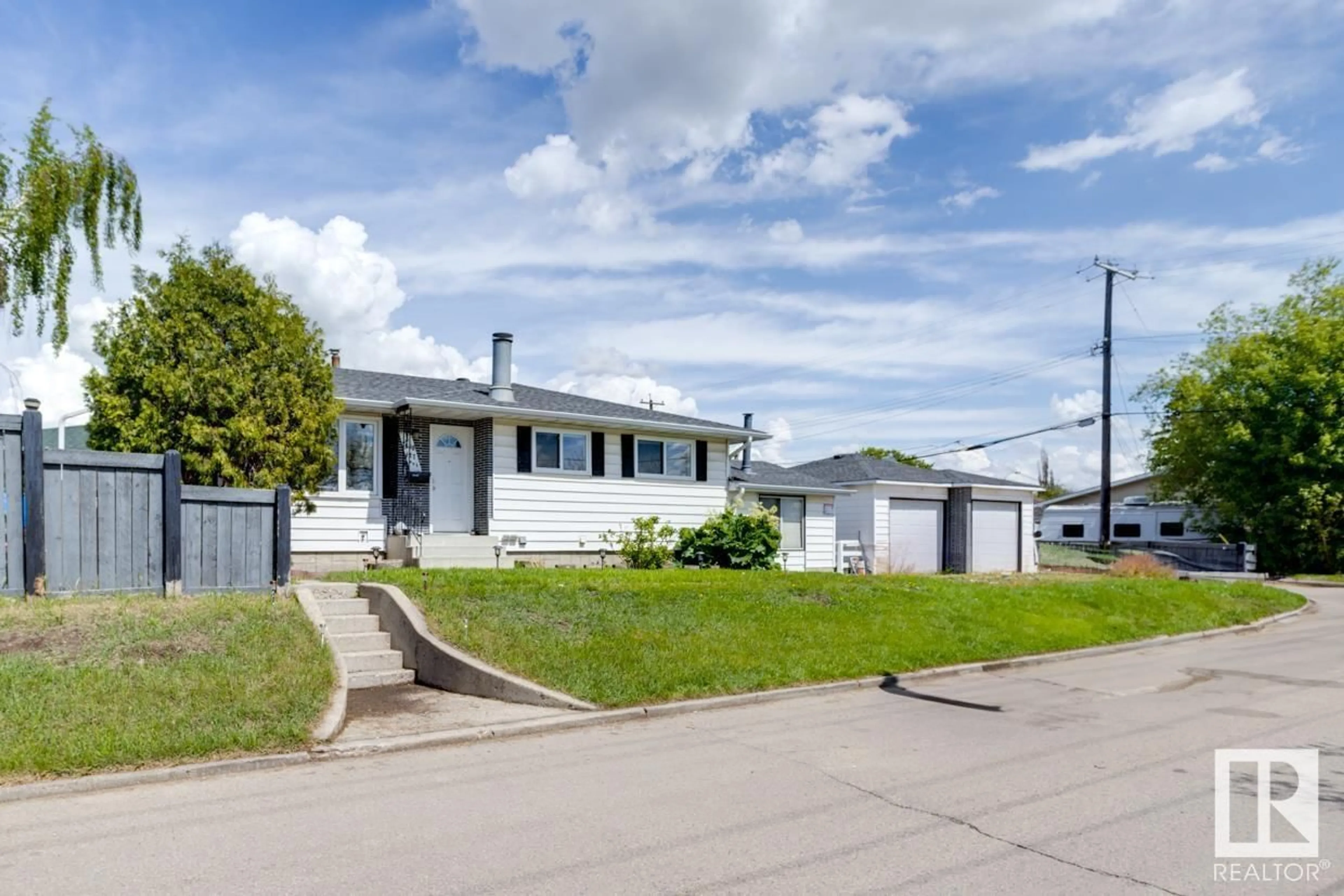 Frontside or backside of a home for 7608 127 AV NW, Edmonton Alberta T5C1R8