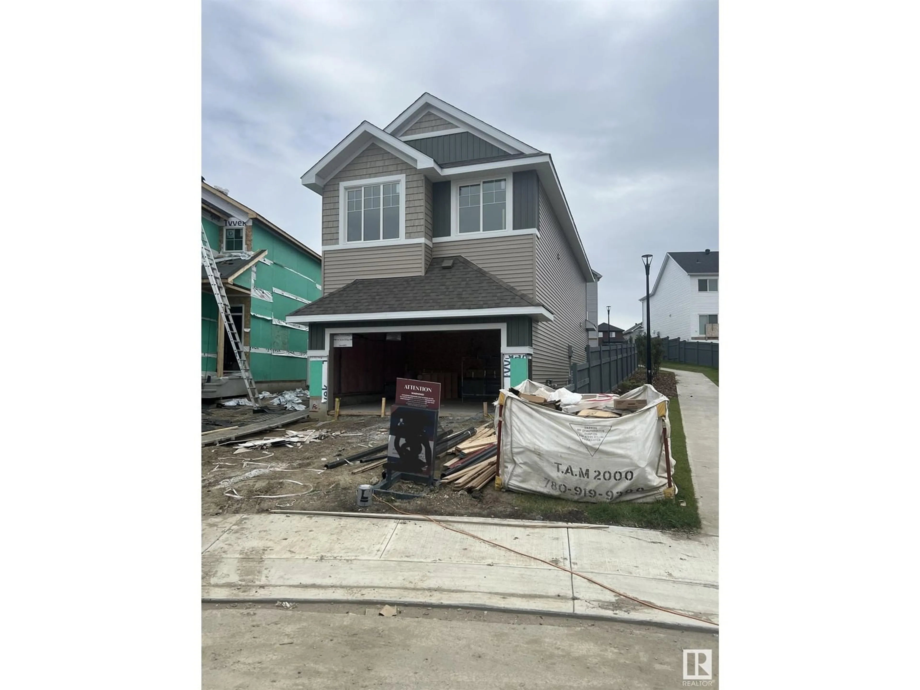 Frontside or backside of a home, the street view for 4934 KINNEY RD SW, Edmonton Alberta T6W5H1