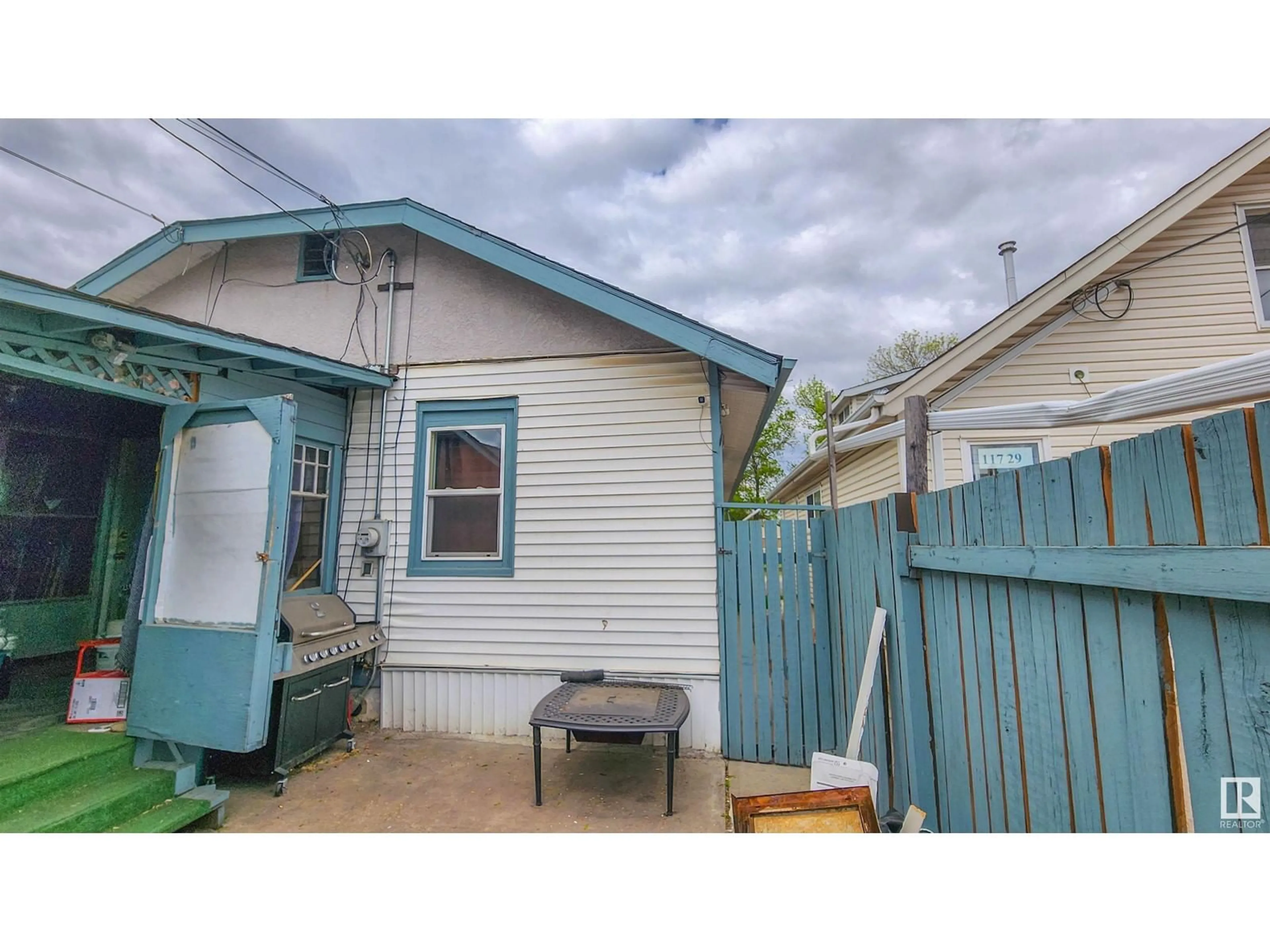 Frontside or backside of a home for 11725 97 ST NW, Edmonton Alberta T5G1Y3