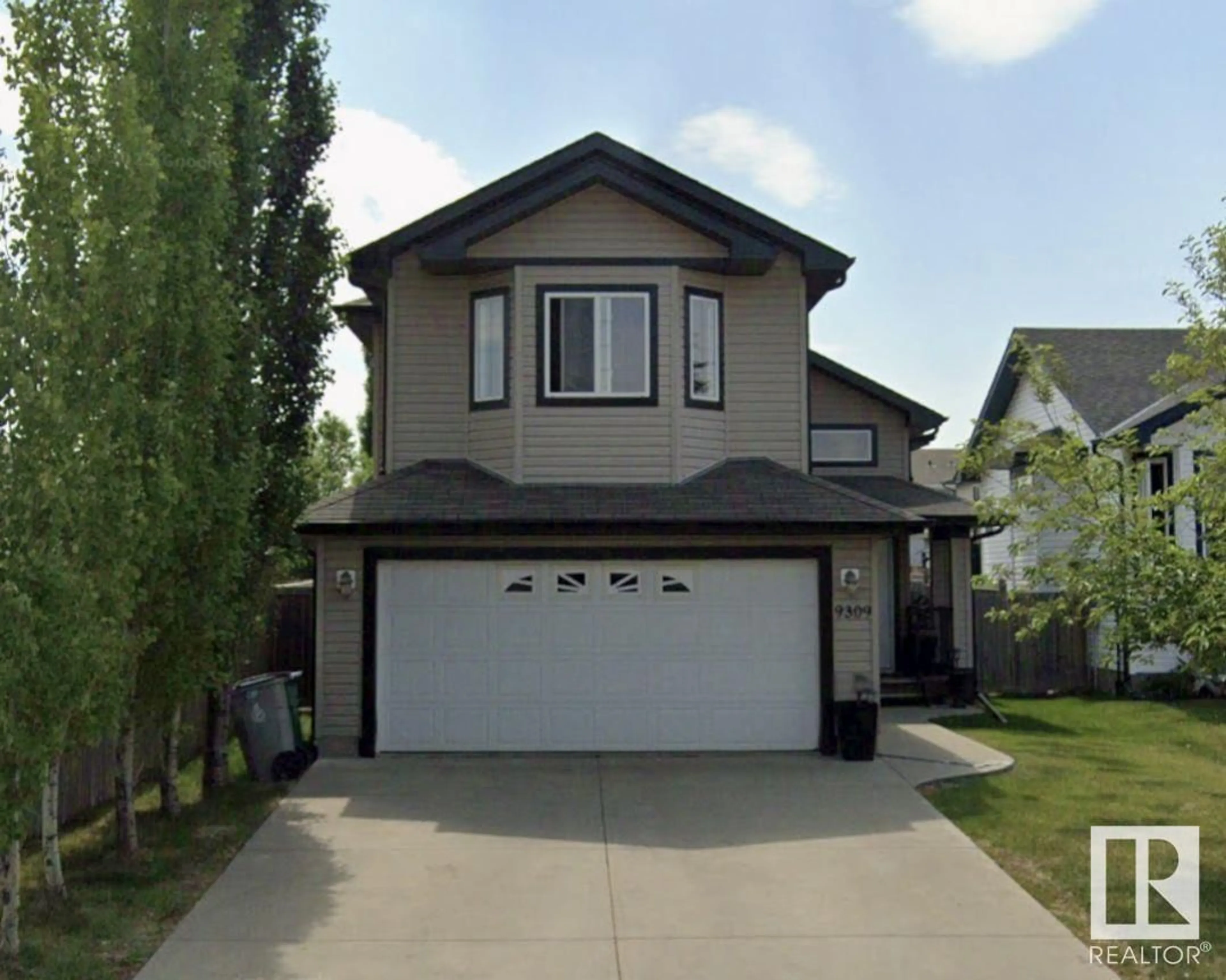Frontside or backside of a home for 9309 106 AV, Morinville Alberta T8R1T9