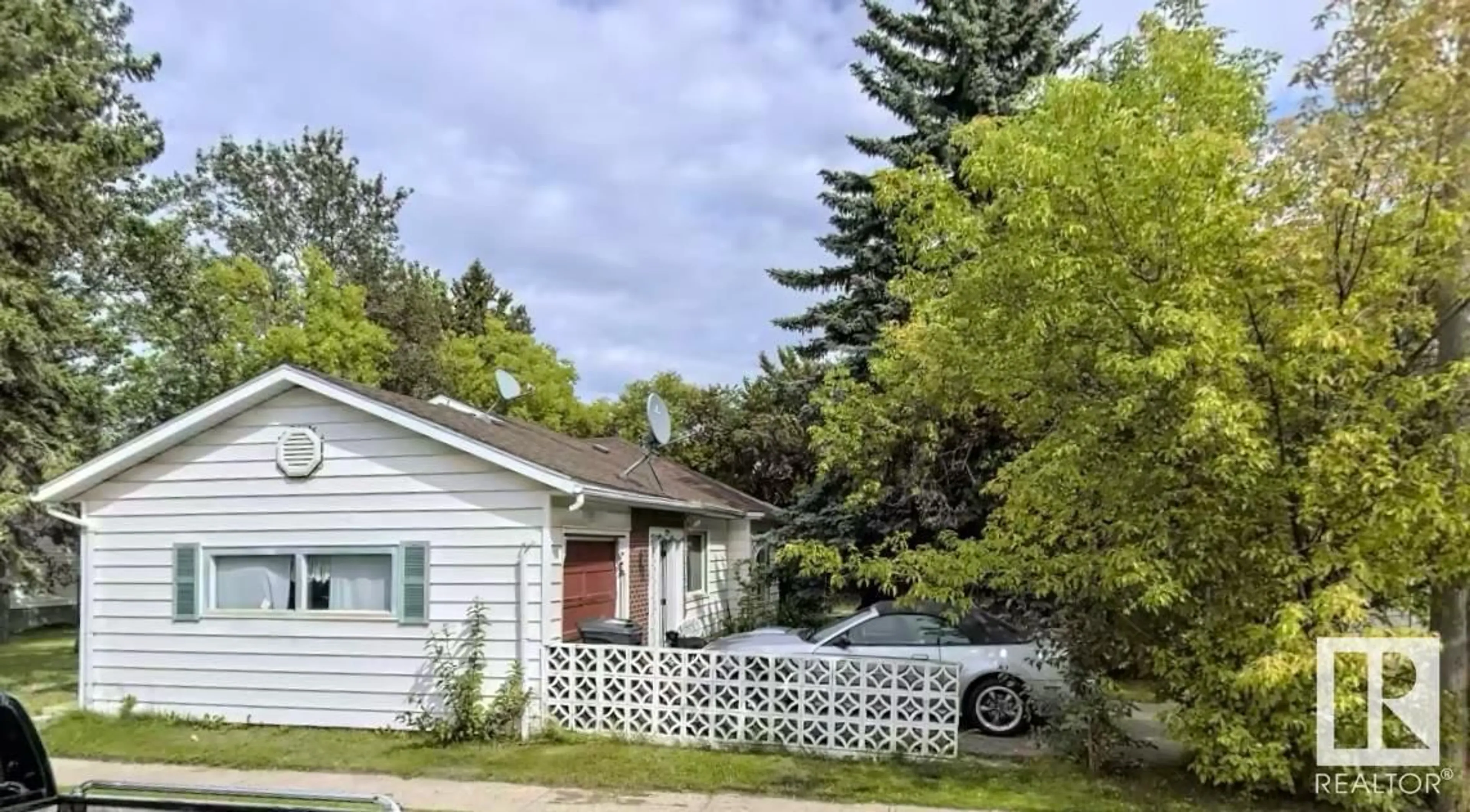 Frontside or backside of a home, the fenced backyard for 5012 51 AV, Cold Lake Alberta T9M1X2