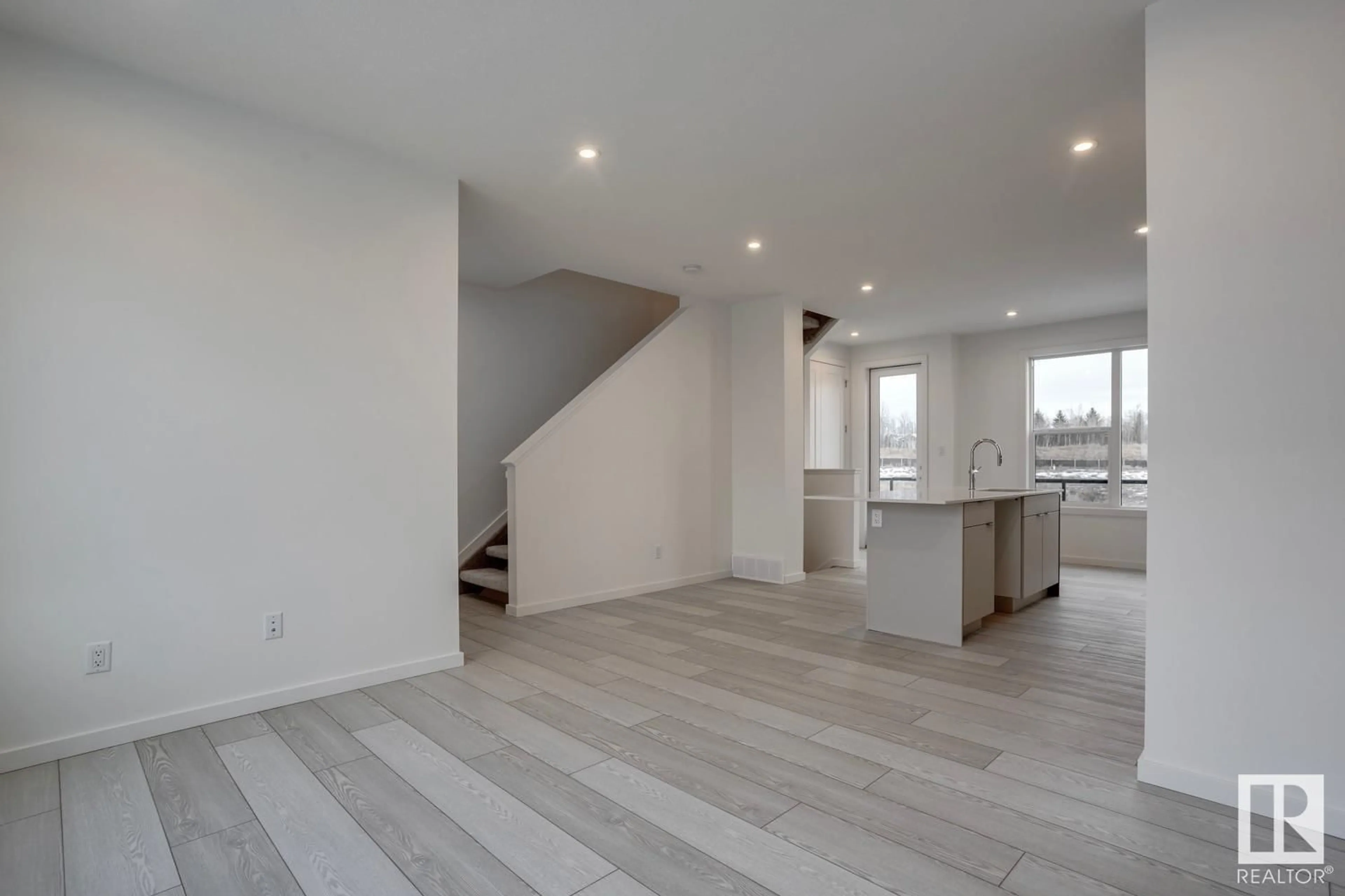 A pic of a room, wood floors for #14 5 Rondeau DR, St. Albert Alberta T8N7X8