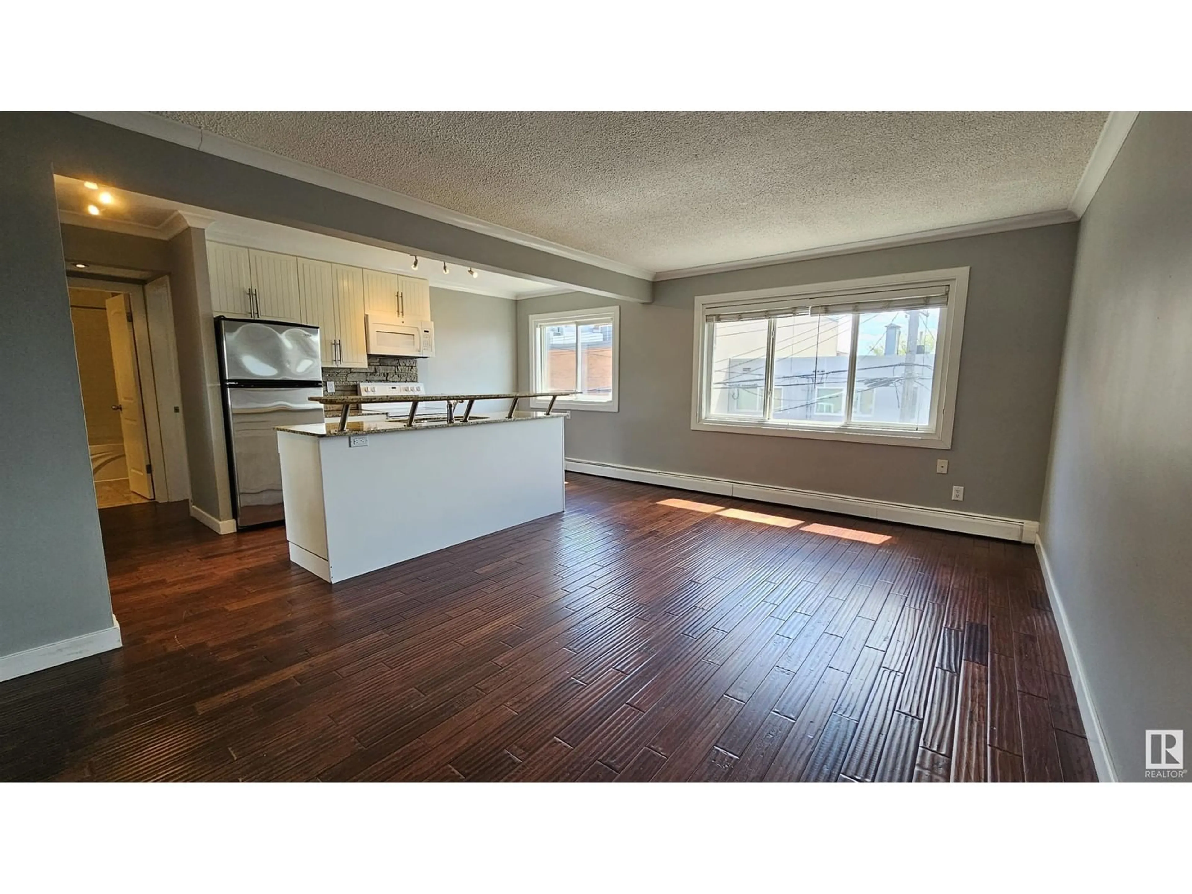 Open concept kitchen for #34 10525 83 AV NW, Edmonton Alberta T6E2E1