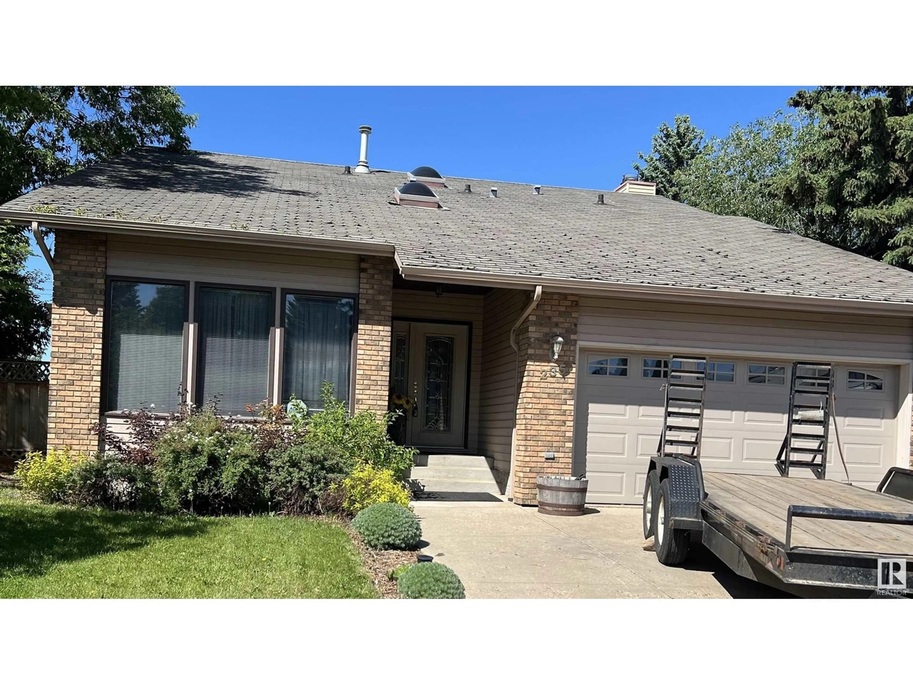 Frontside or backside of a home for 235 GRAND MEADOW CR NW, Edmonton Alberta T6L1W9