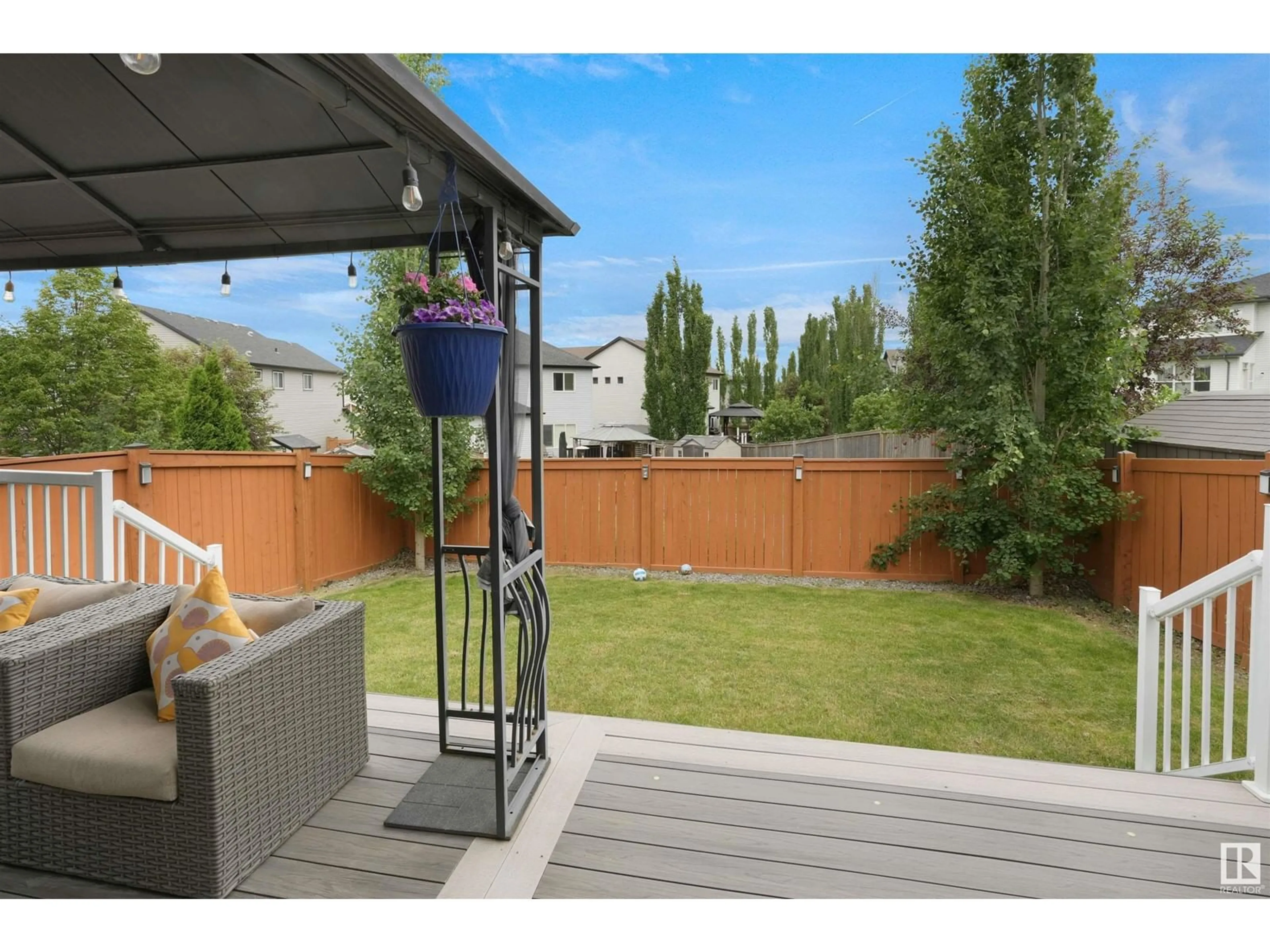 Patio, the fenced backyard for 22219 96 AV NW, Edmonton Alberta T5T7E5