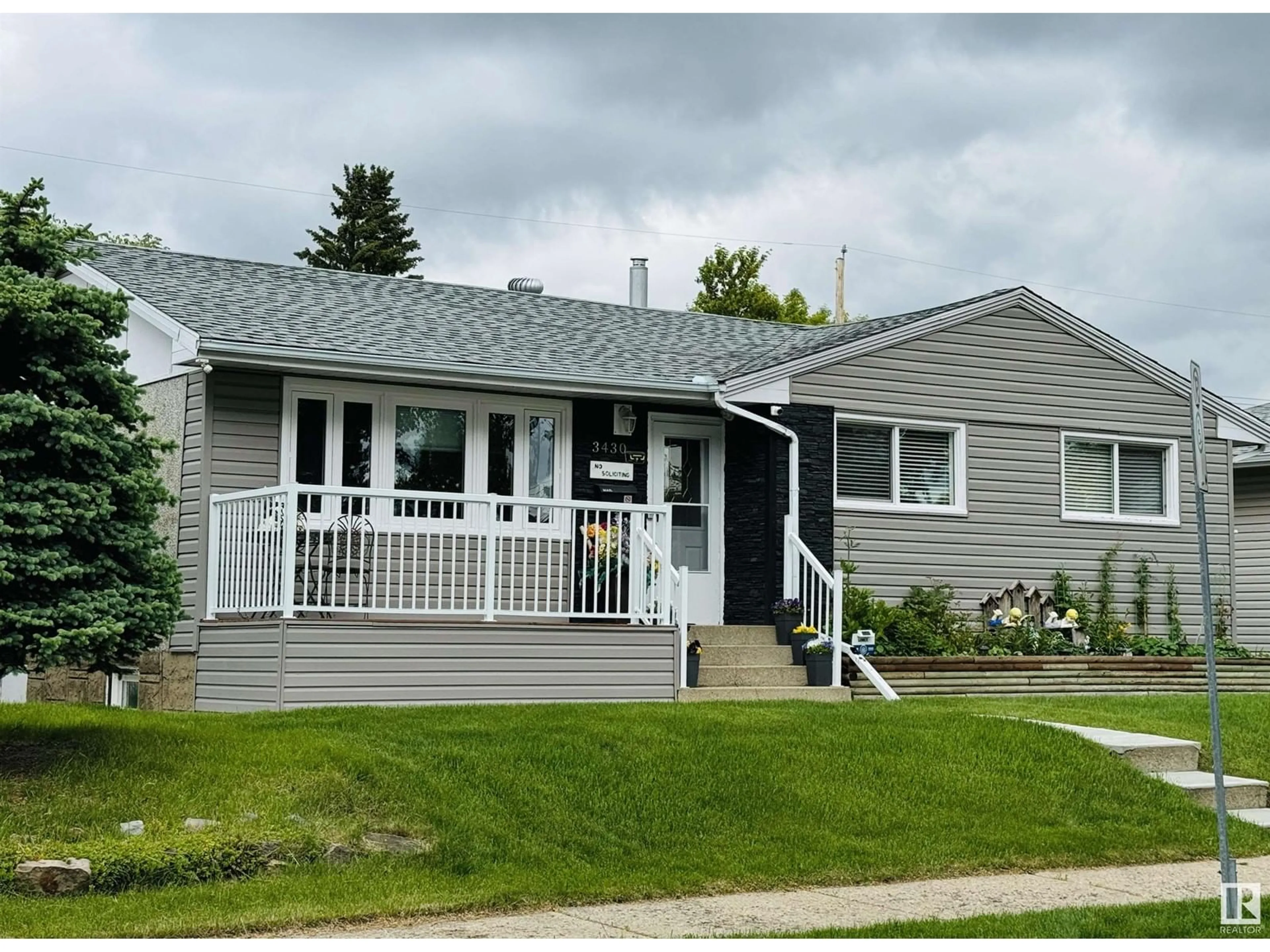 Home with vinyl exterior material for 3430 120 AV NW, Edmonton Alberta T5W1Z9
