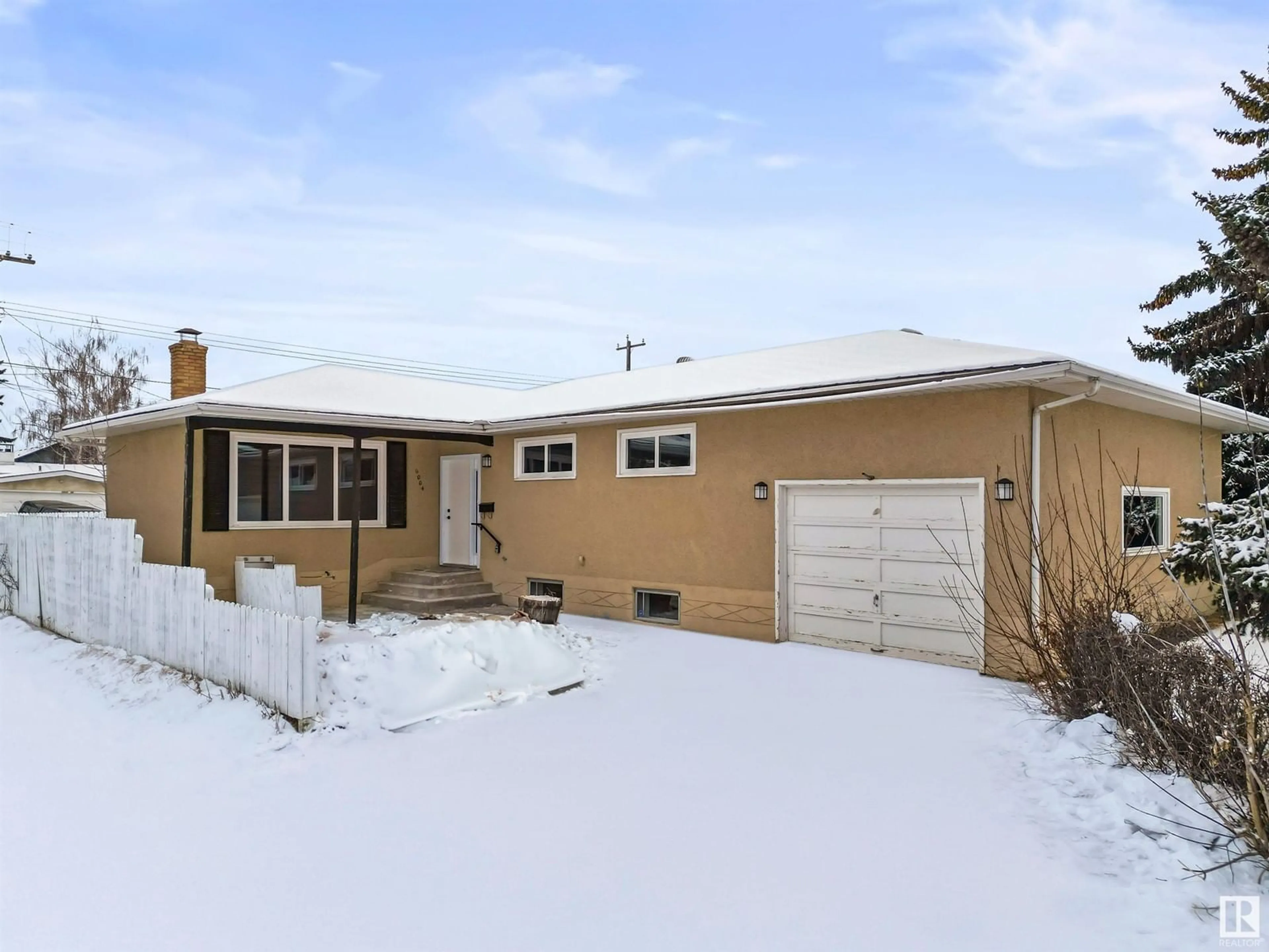 Frontside or backside of a home for 6004 89 AV NW, Edmonton Alberta T6B0M9