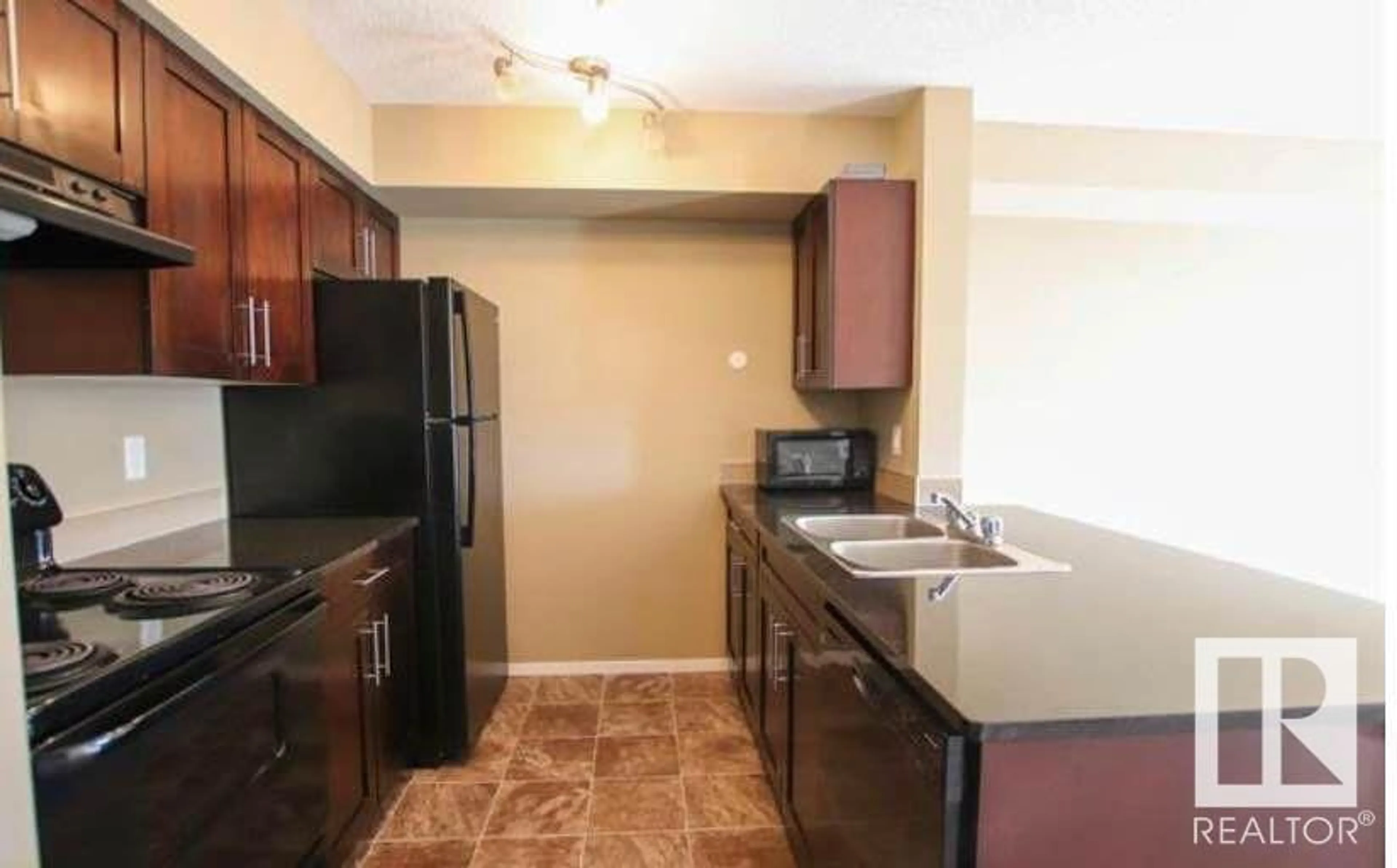 Standard kitchen, carpet floors, cottage for #308 3211 JAMES MOWATT TR SW, Edmonton Alberta T6W3L6