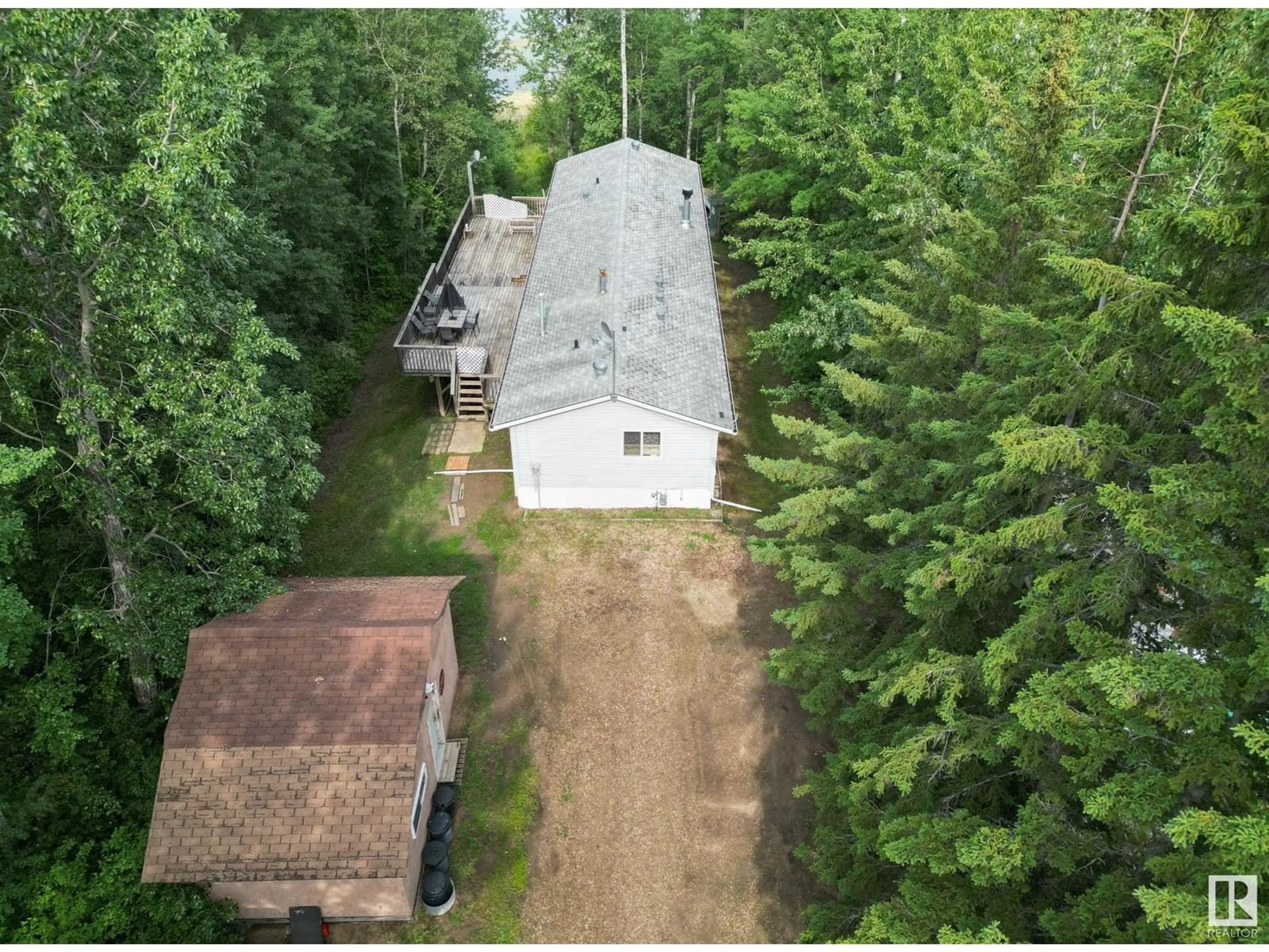 A pic from outside/outdoor area/front of a property/back of a property/a pic from drone, forest/trees view for 49 Neilson Dr., Rural Athabasca County Alberta T9S1S1