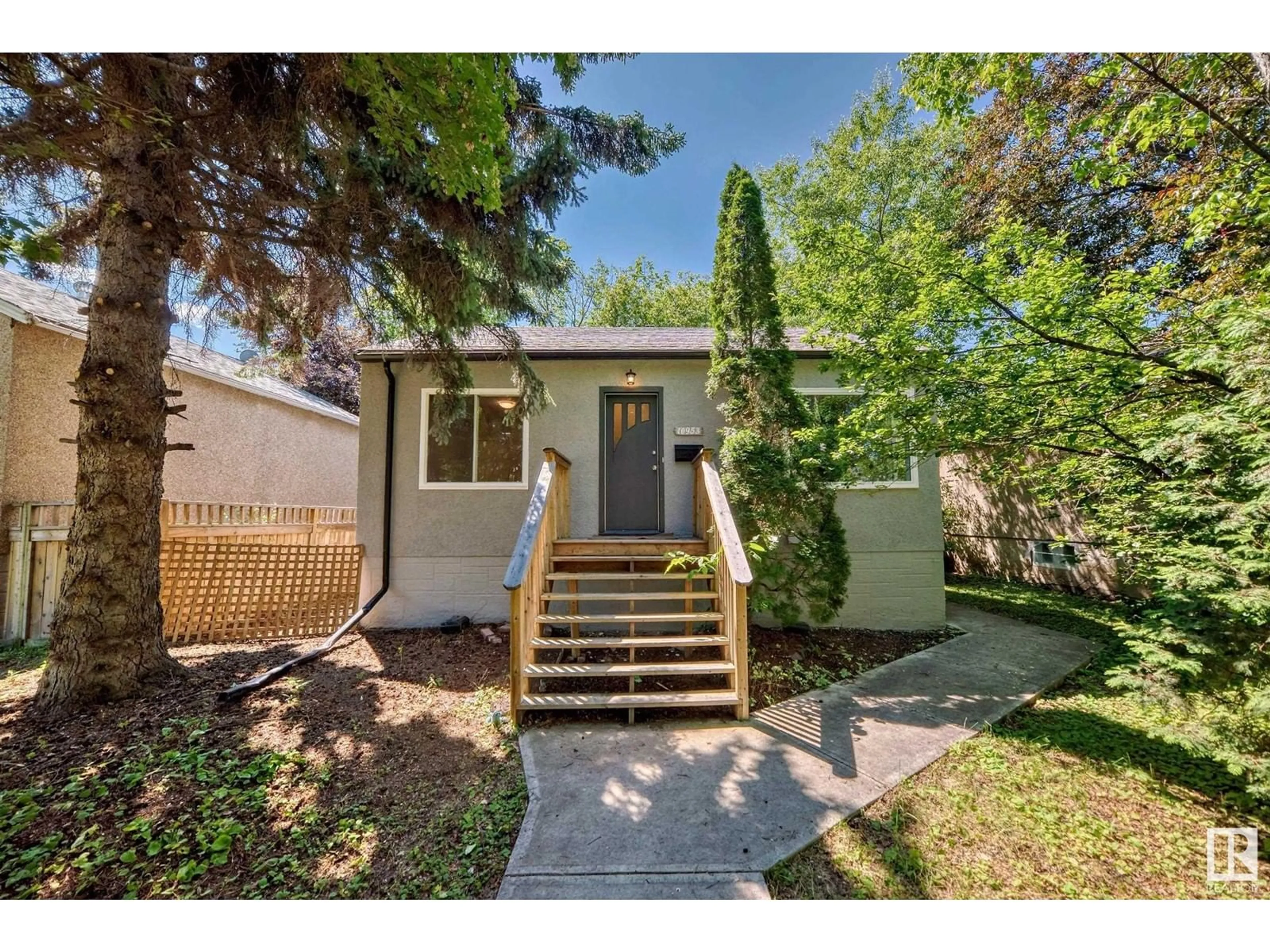 Frontside or backside of a home for 10953 74 AV NW, Edmonton Alberta T6G0E5