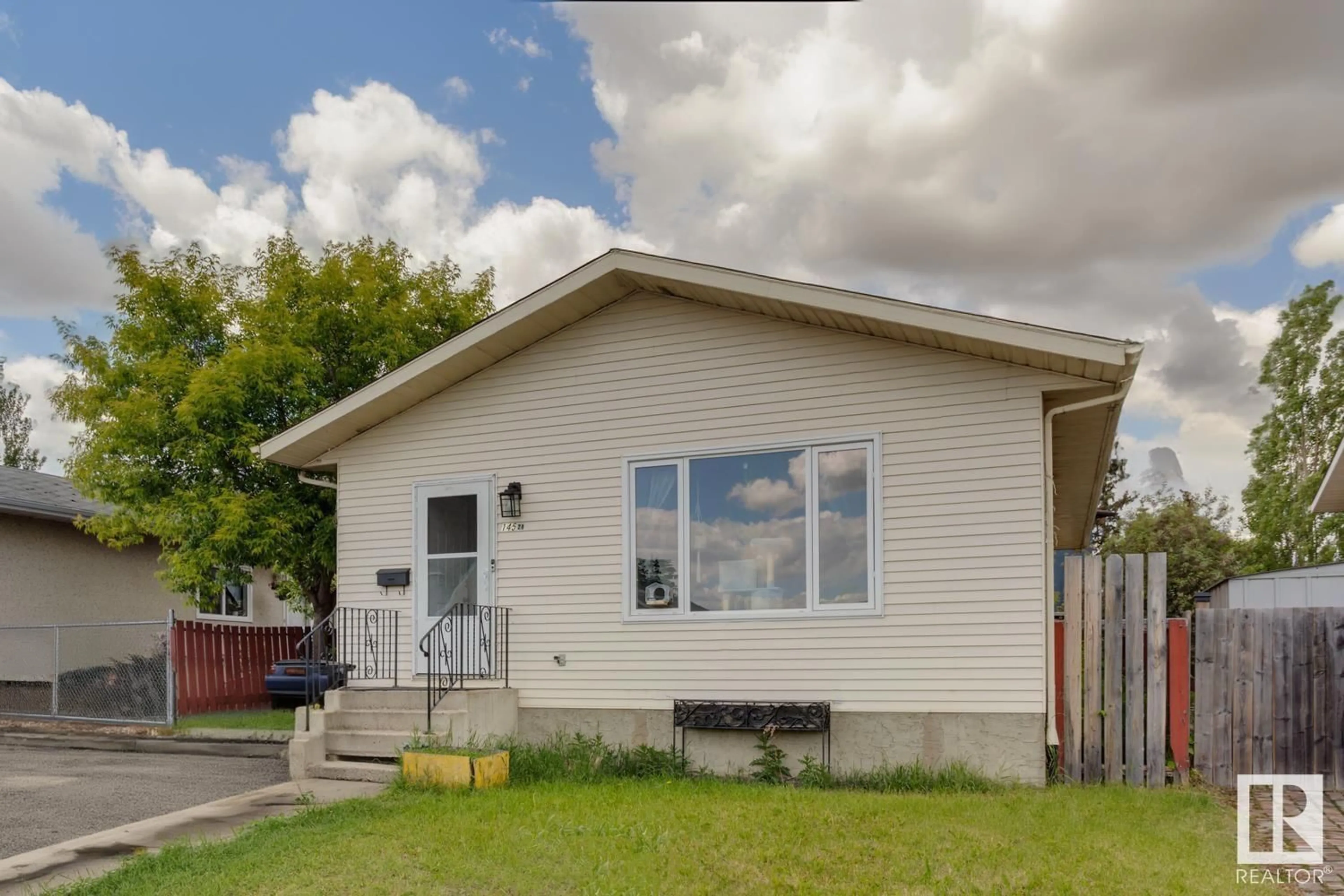 Frontside or backside of a home, the front or back of building for 14528 34 ST NW, Edmonton Alberta T5Y2J2