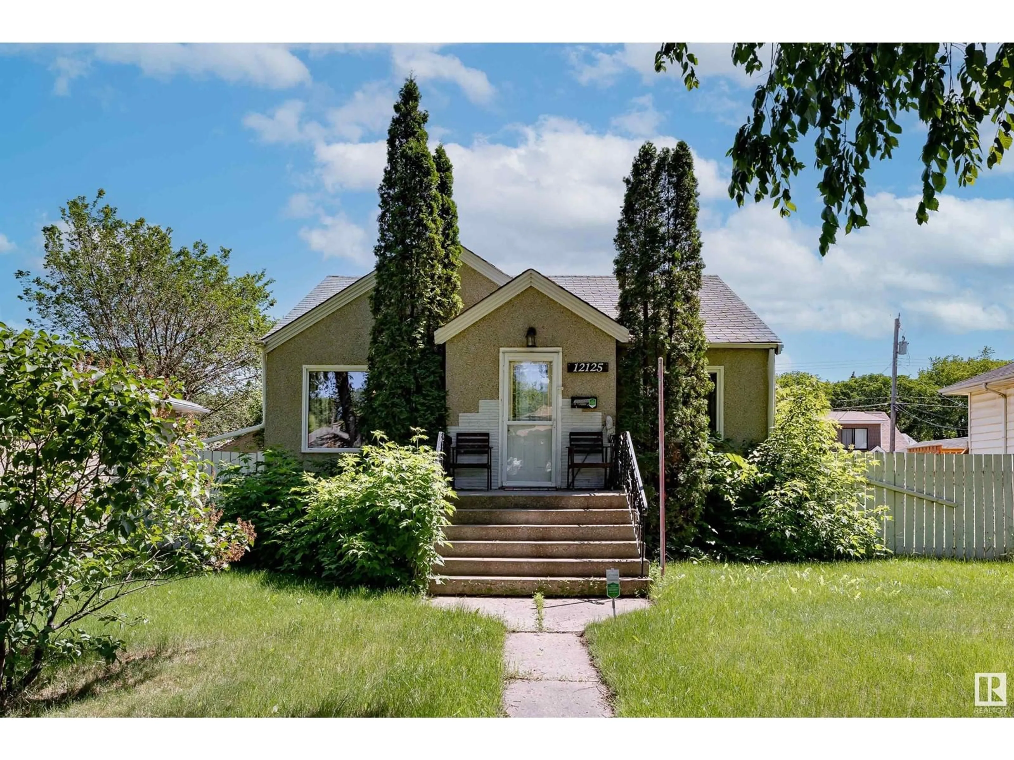 Frontside or backside of a home for 12125 63 ST NW, Edmonton Alberta T5W4G7