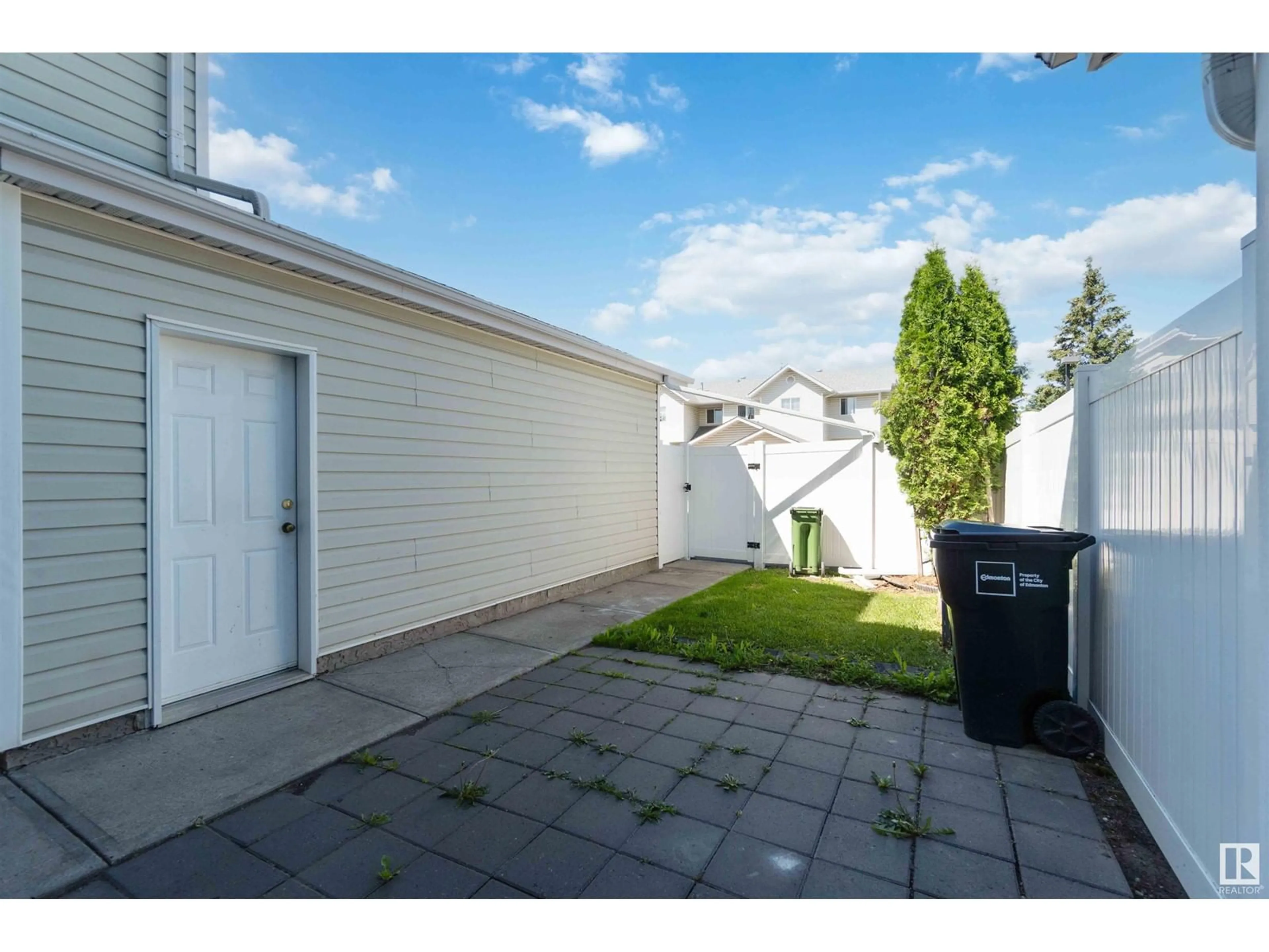 Patio, the fenced backyard for #2 8203 160 AV NW, Edmonton Alberta T5Z3C1