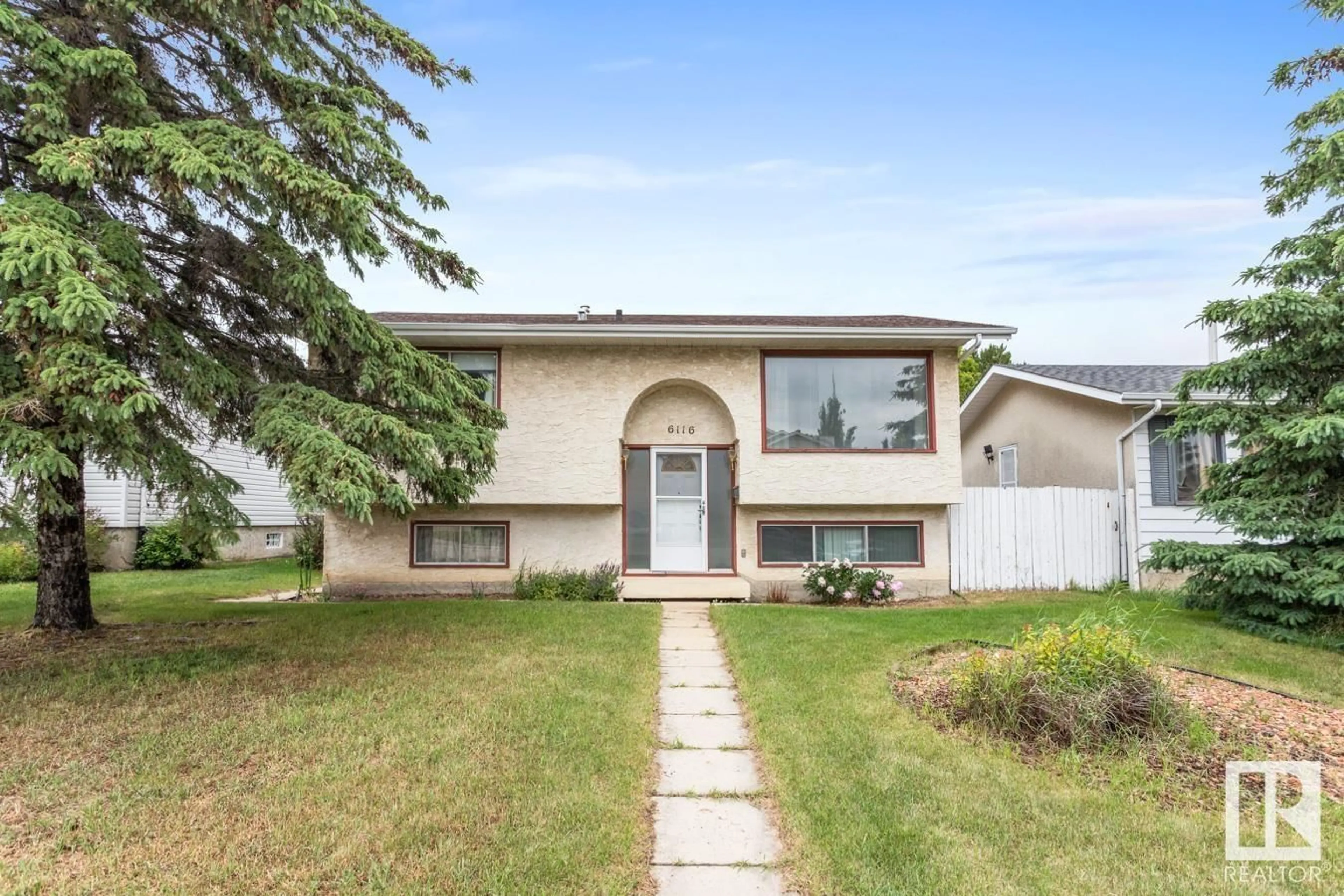 Frontside or backside of a home for 6116 40 AV NW, Edmonton Alberta T6L1W7