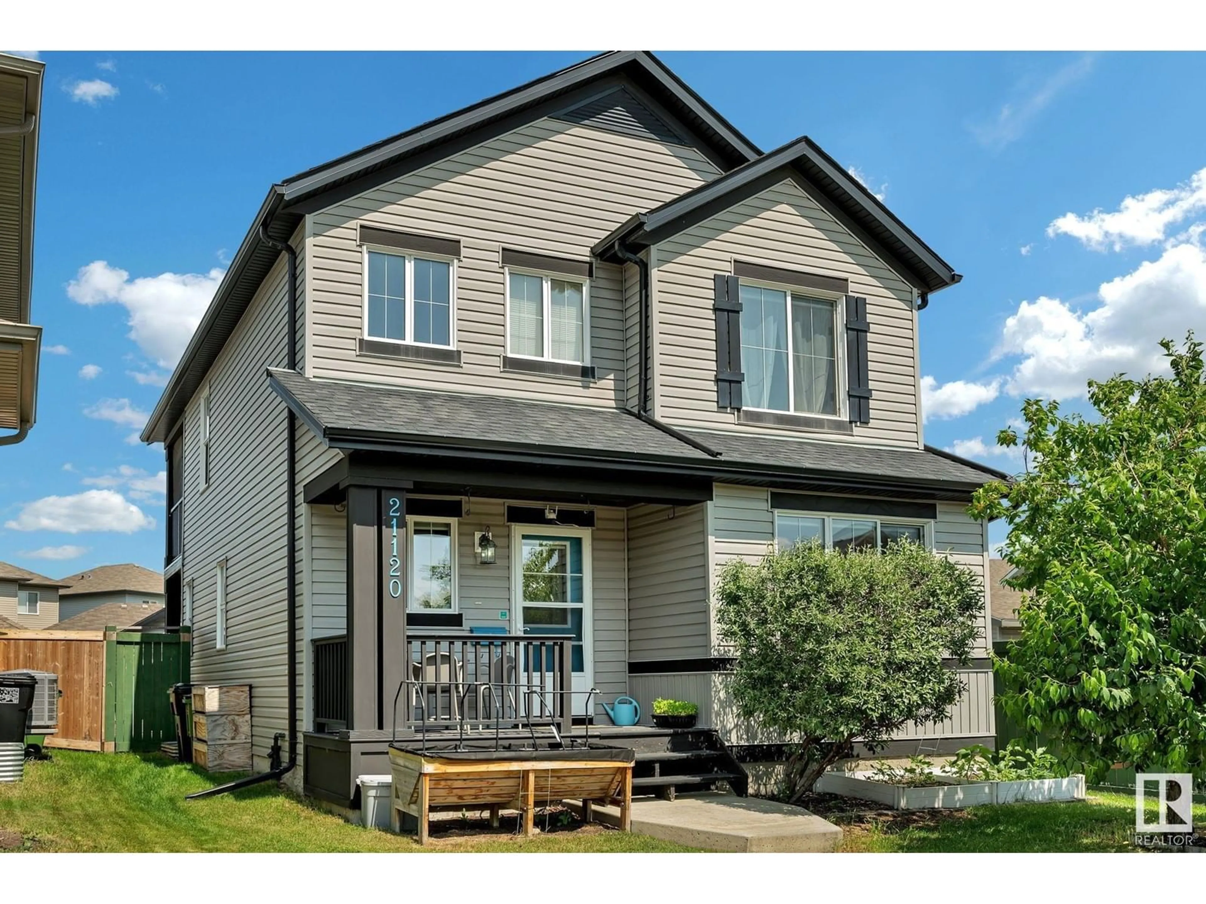 Frontside or backside of a home for 21120 96 AV NW, Edmonton Alberta T5T4J6