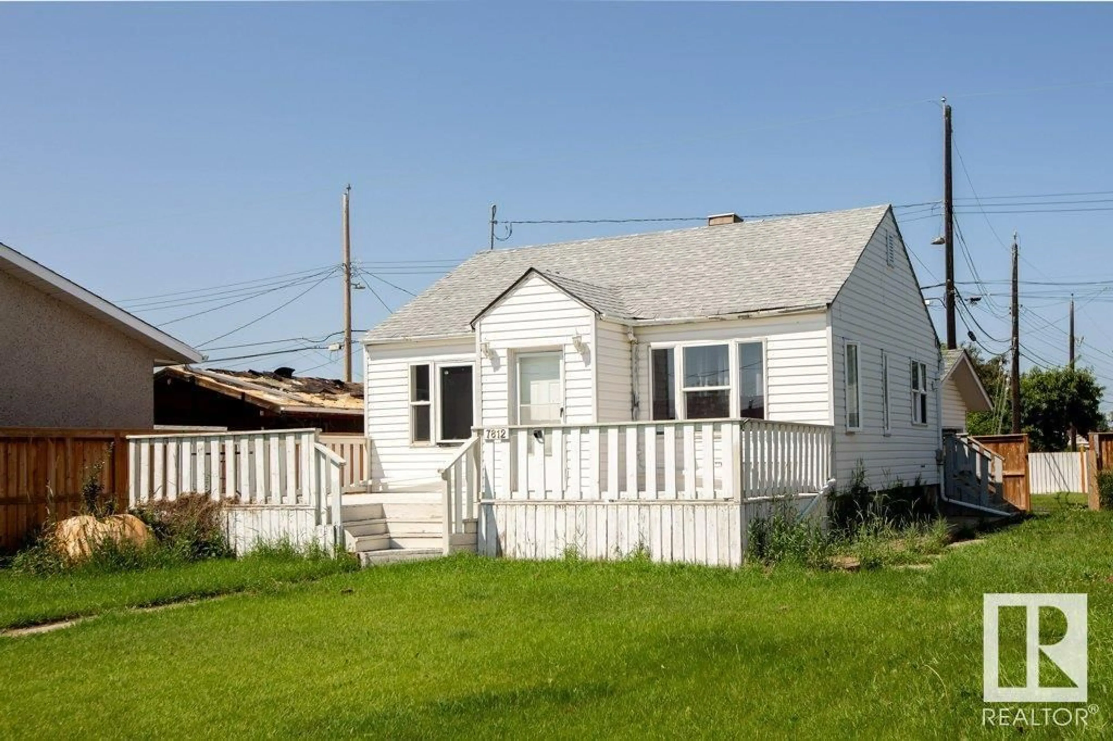 Frontside or backside of a home for 7812 128 AV NW, Edmonton Alberta T5C1T7