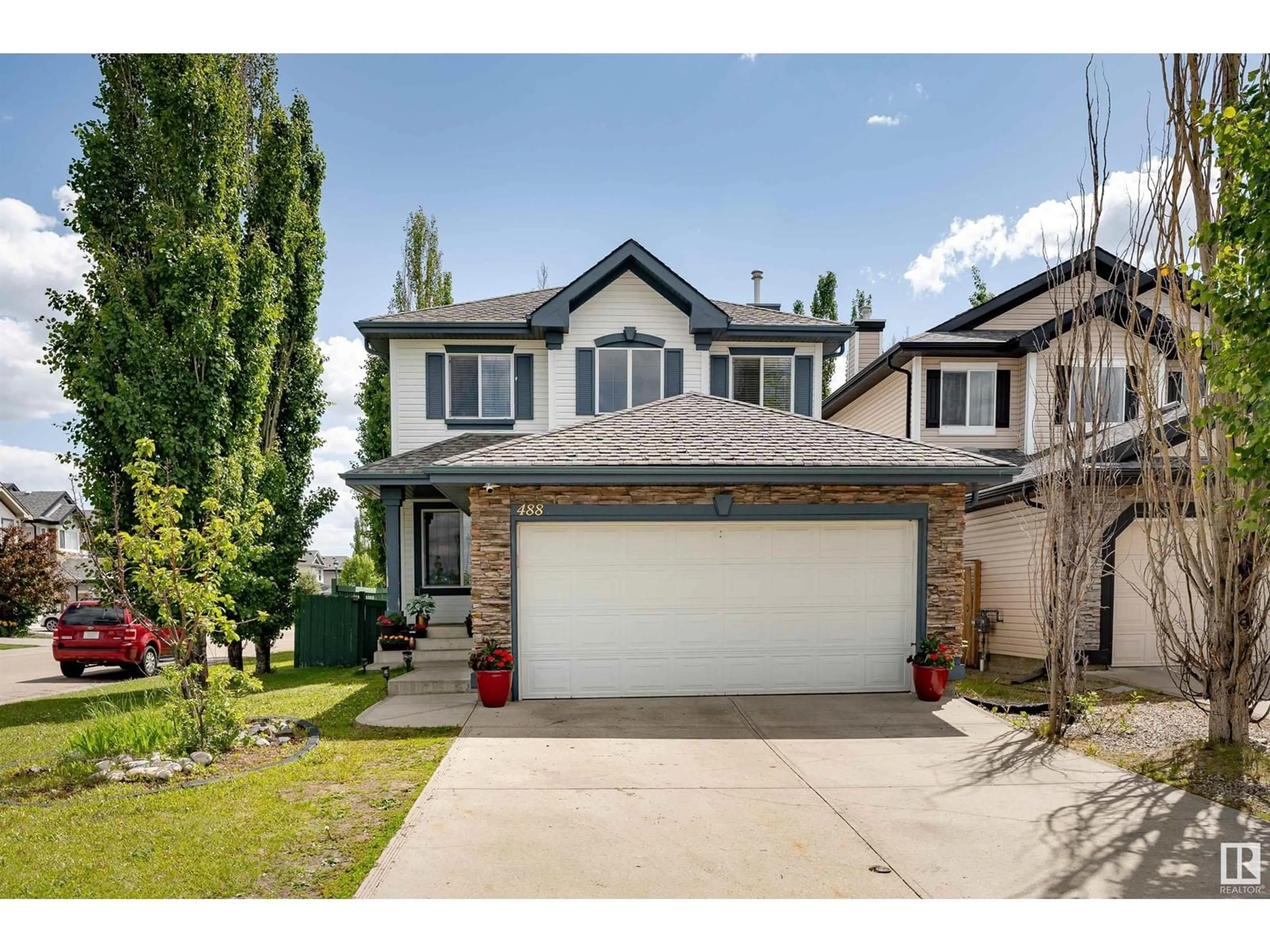 Frontside or backside of a home for 488 HUNTERS GR NW, Edmonton Alberta T6R3L3