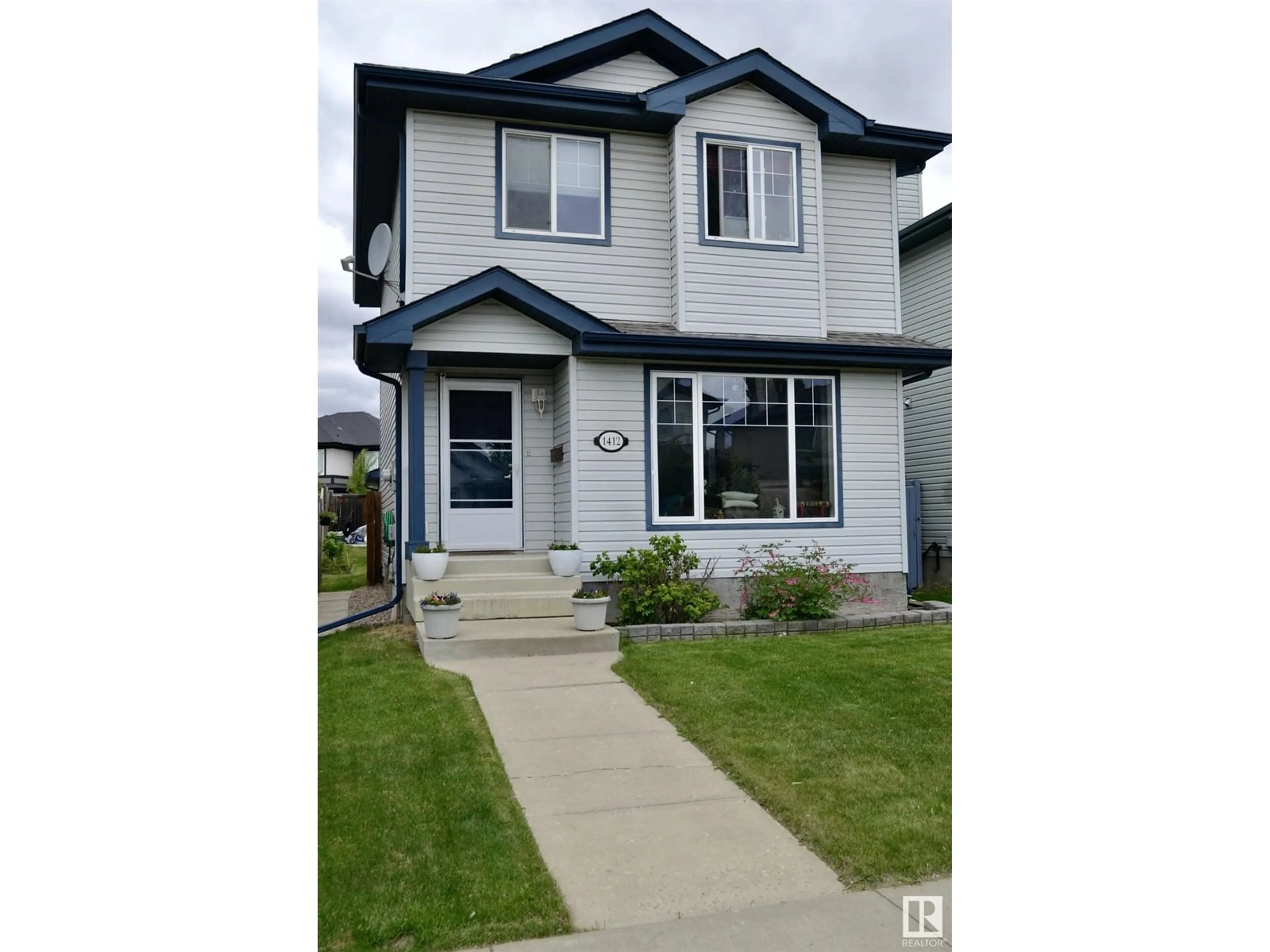 Frontside or backside of a home for 1412 GOODSPEED LN NW, Edmonton Alberta T5T6S3