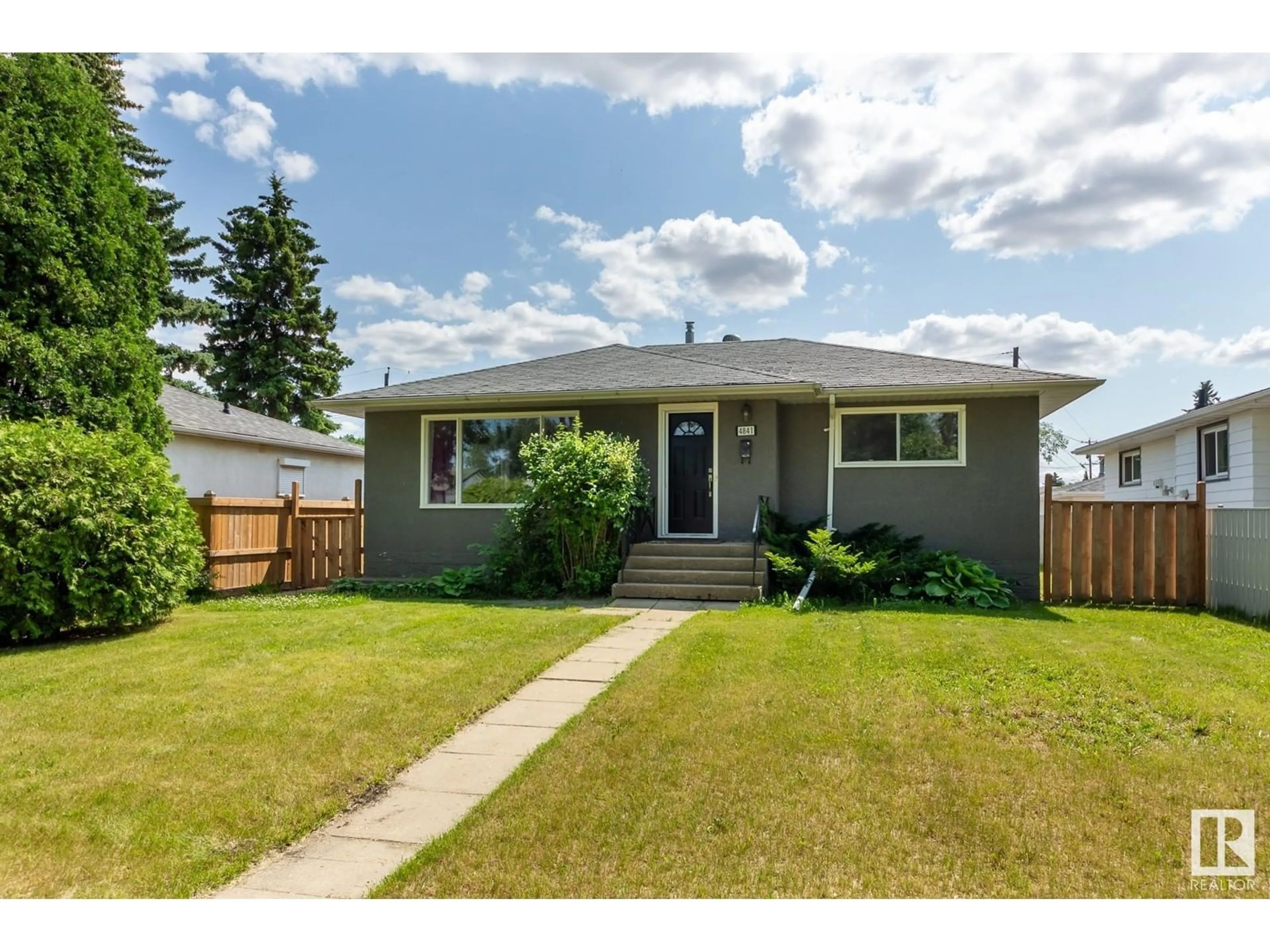 Frontside or backside of a home for 4841 116 AV NW, Edmonton Alberta T5W0X7