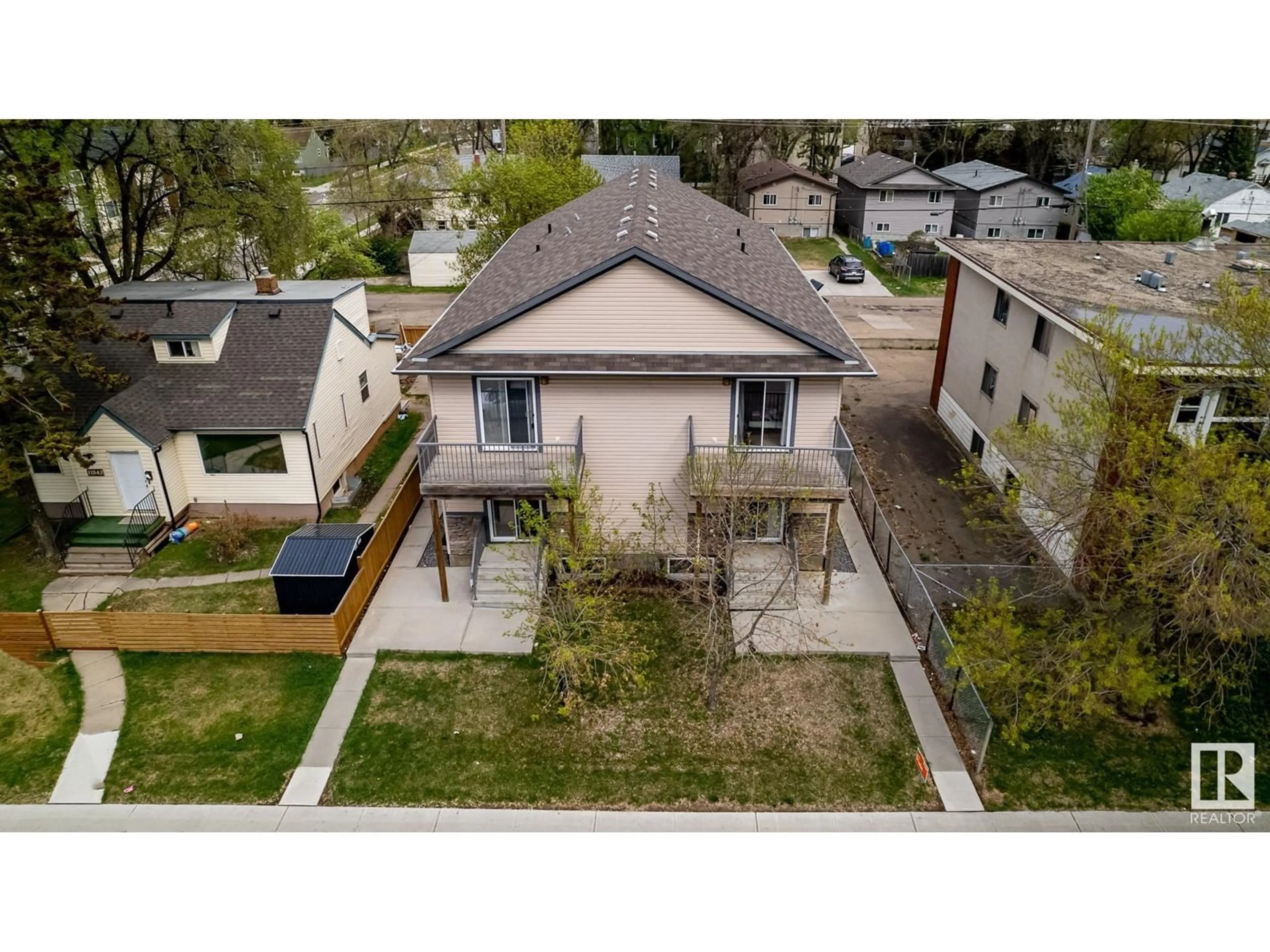 Frontside or backside of a home, the fenced backyard for 11841 97 ST NW, Edmonton Alberta T5G1Y4