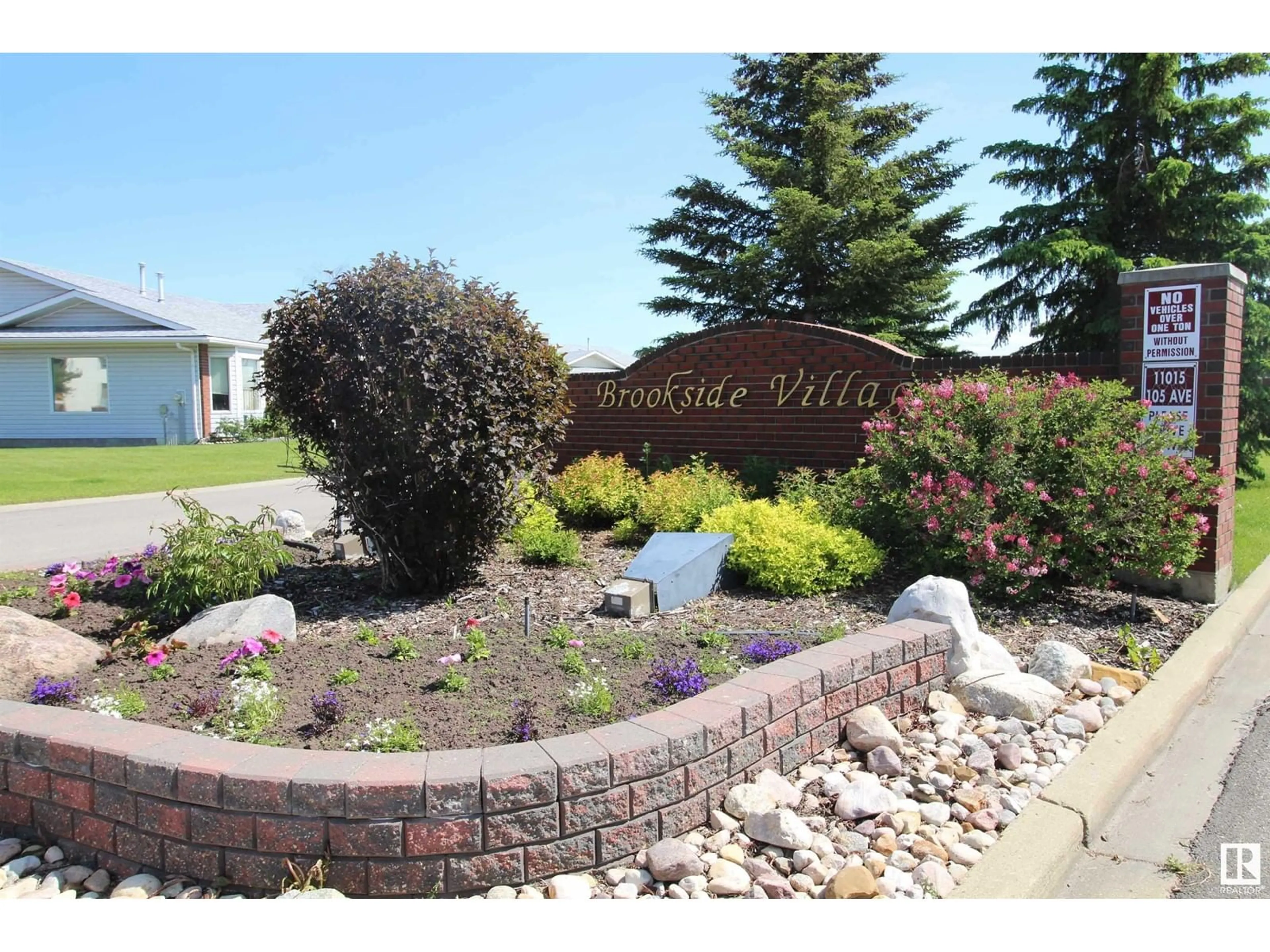 A pic from outside/outdoor area/front of a property/back of a property/a pic from drone, water/lake/river/ocean view for #3 - 11015 105 AV, Westlock Alberta T7P1A1