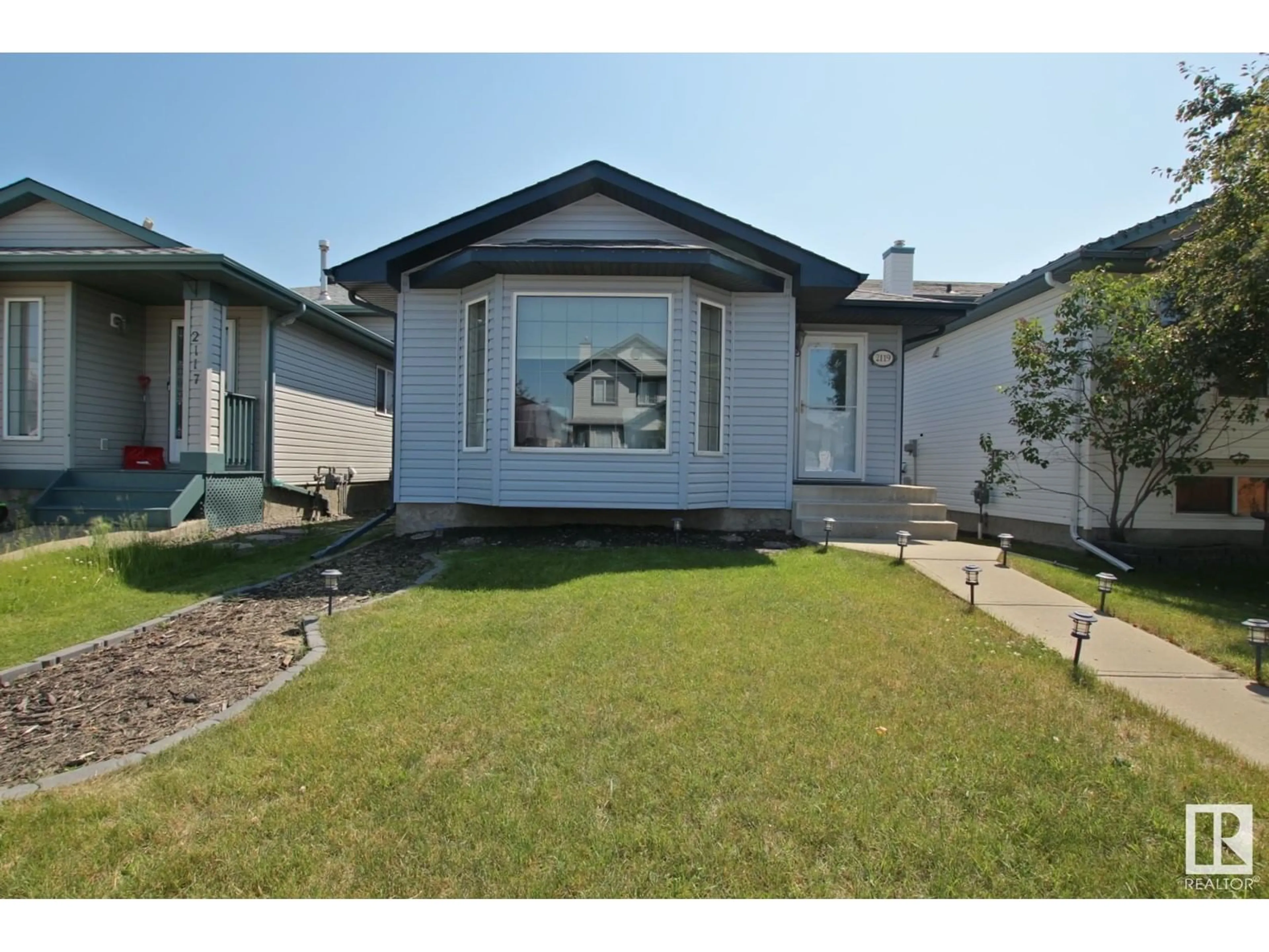 Frontside or backside of a home for 2119 36 AV NW, Edmonton Alberta T6T1S3
