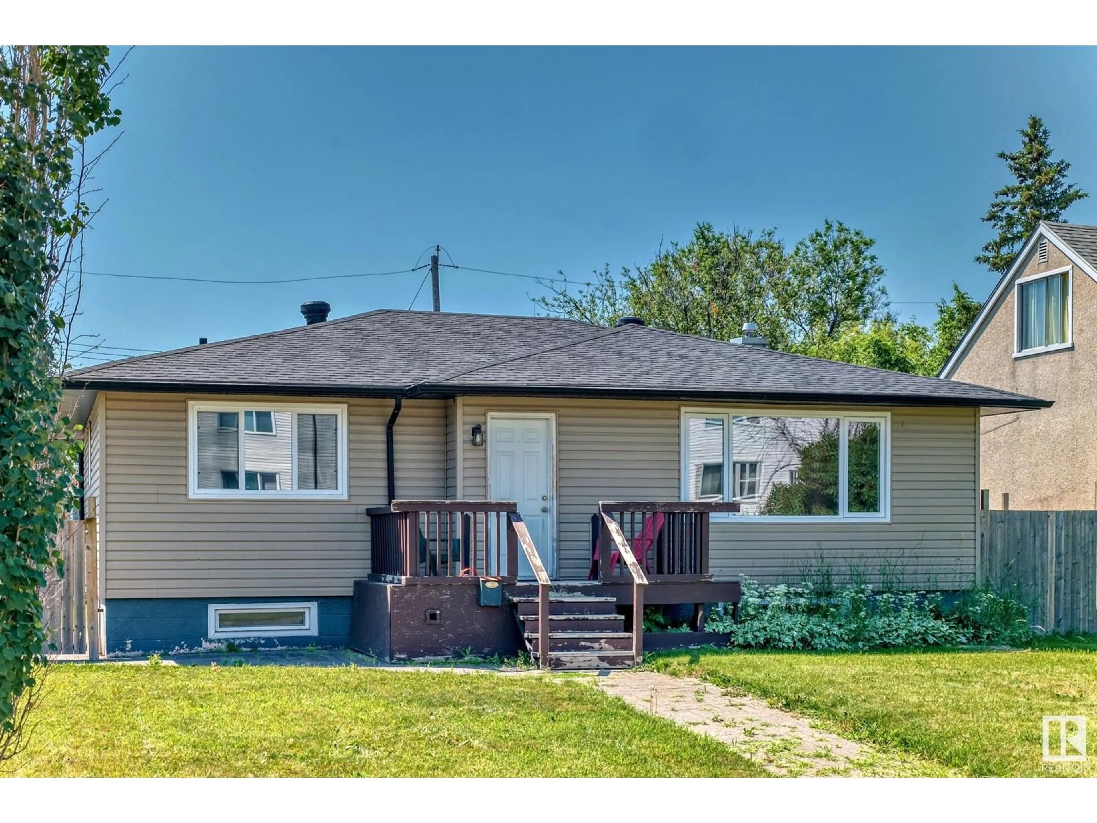 Frontside or backside of a home for 11611 112 AV NW, Edmonton Alberta T5G0H8
