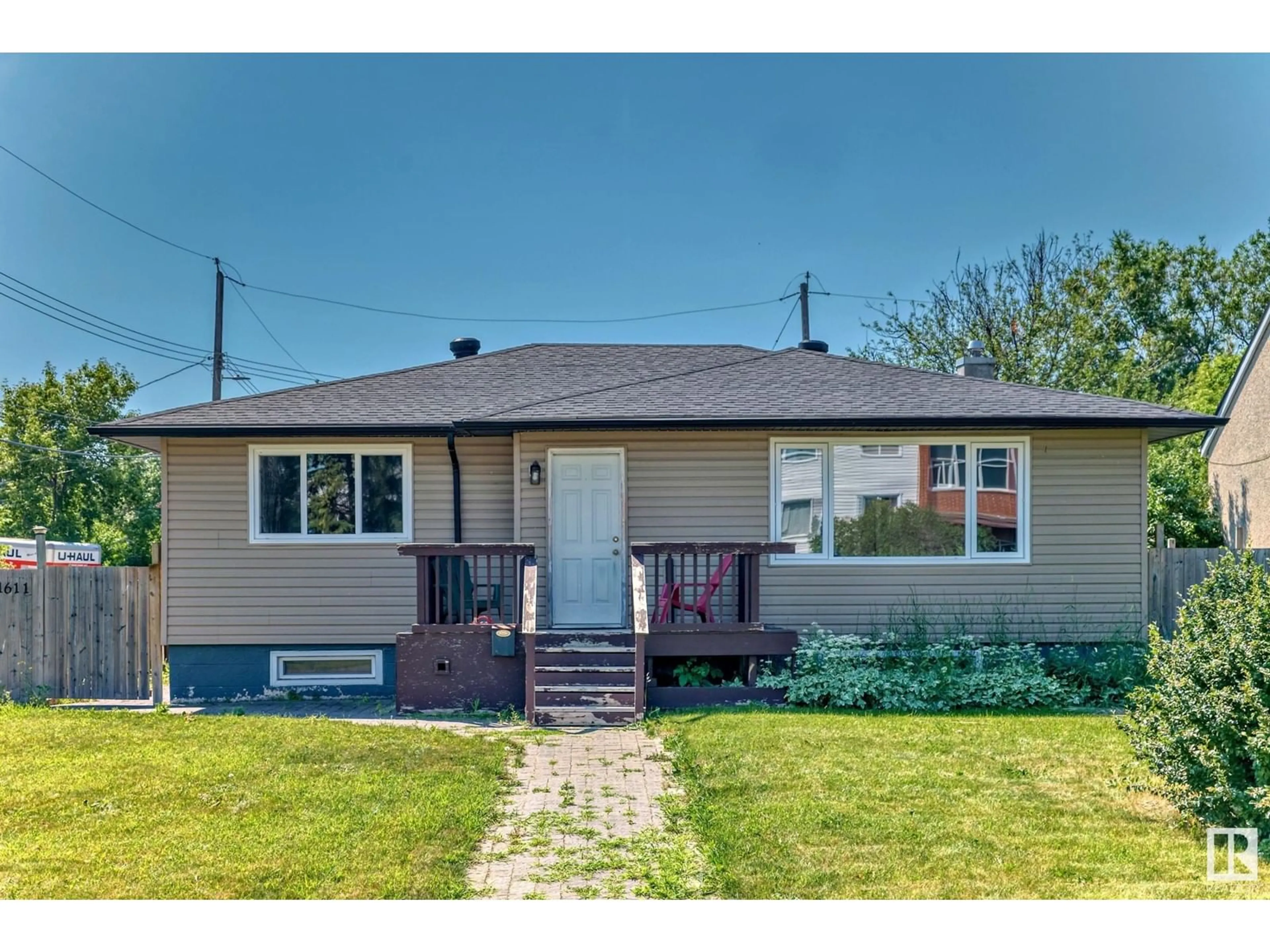 Frontside or backside of a home for 11611 112 AV NW, Edmonton Alberta T5G0H8