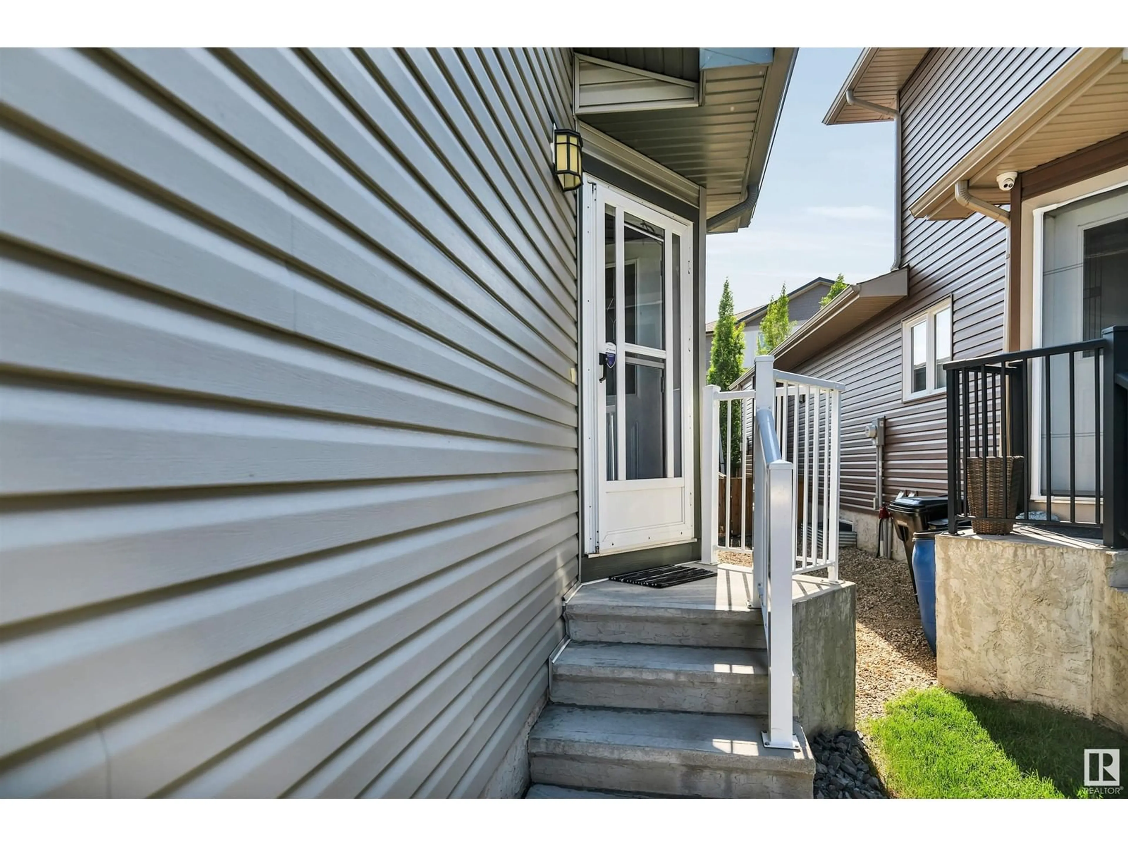 Frontside or backside of a home, the fenced backyard for 16735 60 ST NW, Edmonton Alberta T5T0W5