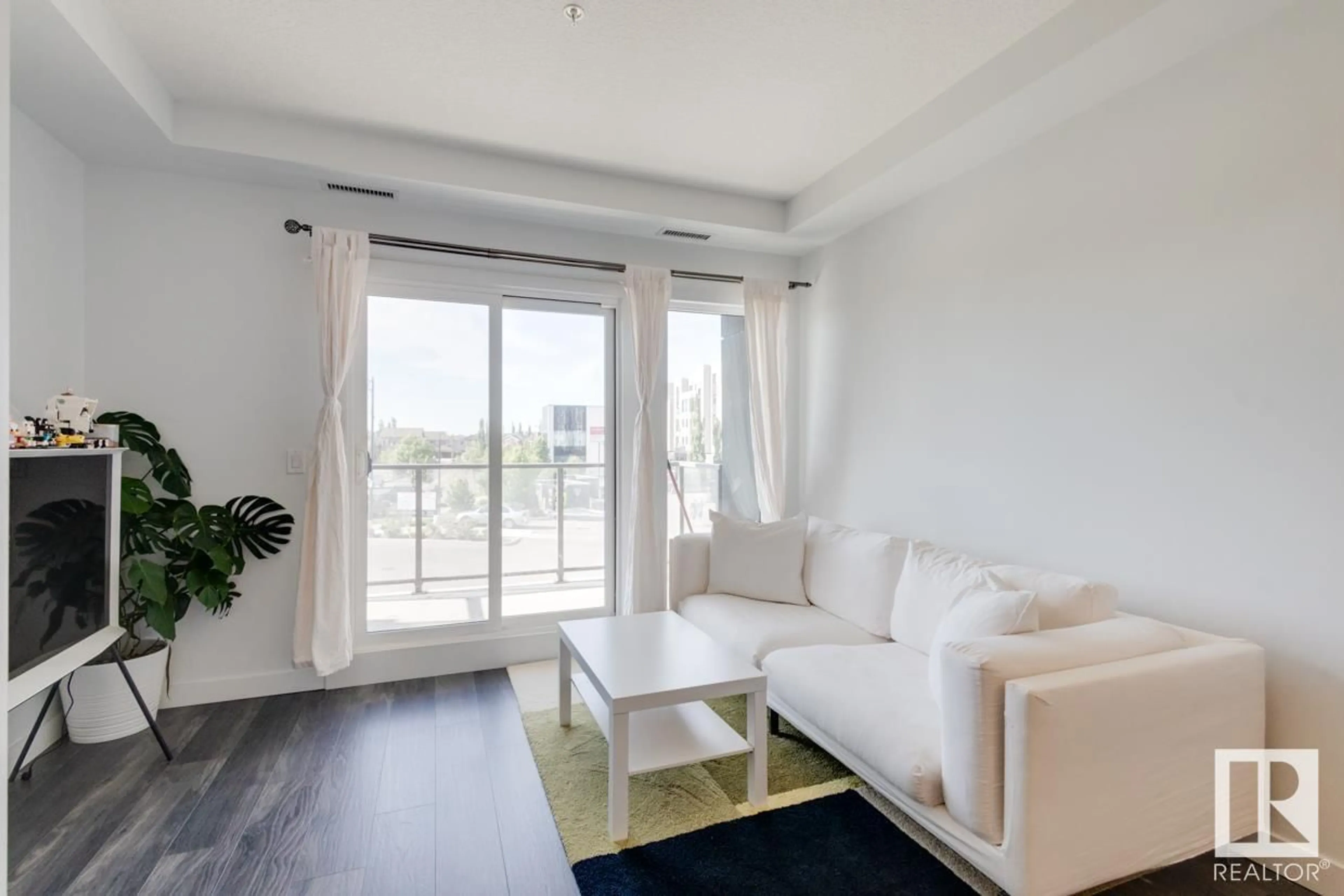 Living room, wood floors for #213 1316 WINDERMERE WY SW, Edmonton Alberta T6W2J3