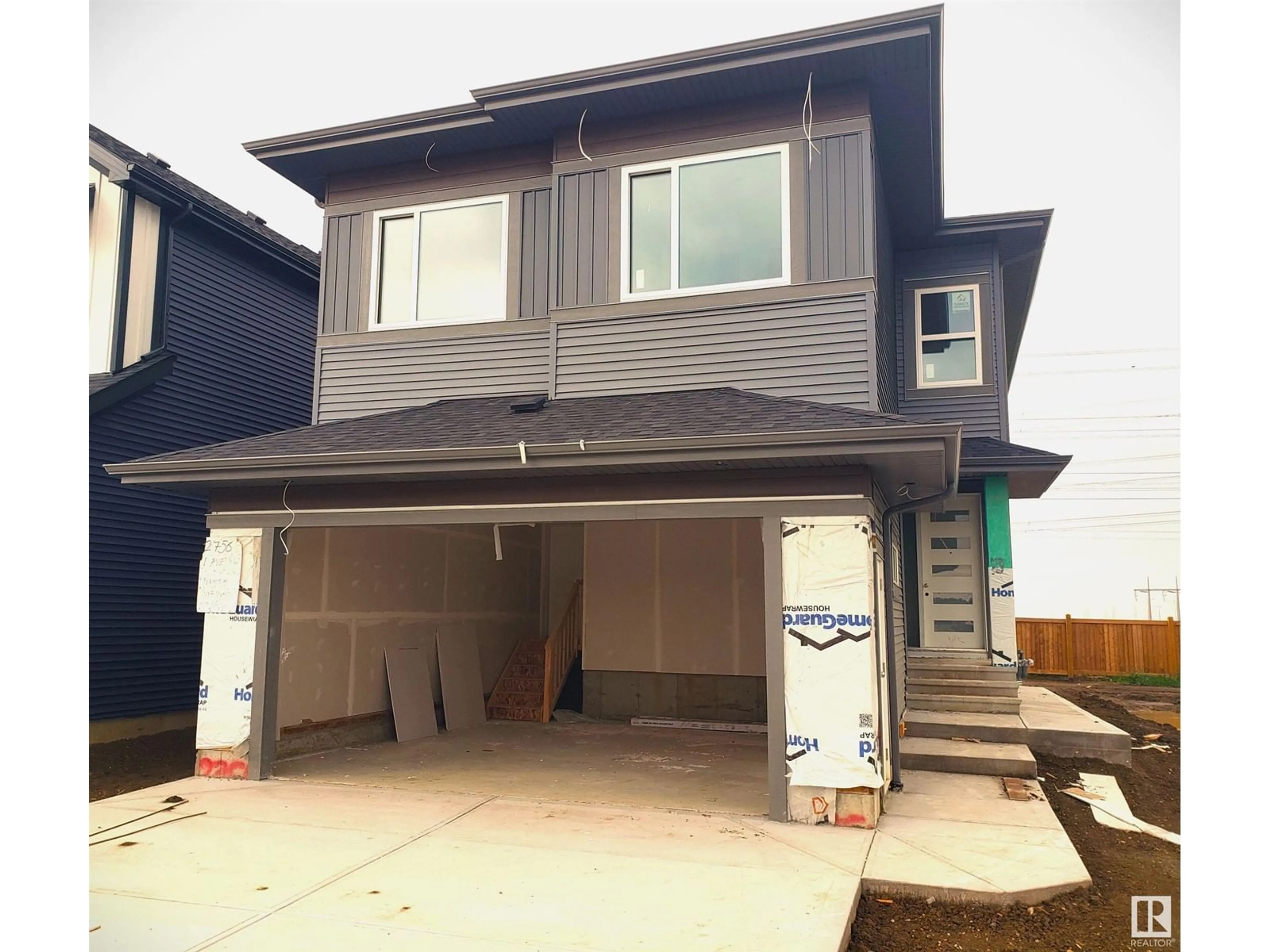 Frontside or backside of a home for 2756 1 AV SW, Edmonton Alberta T6X3E3